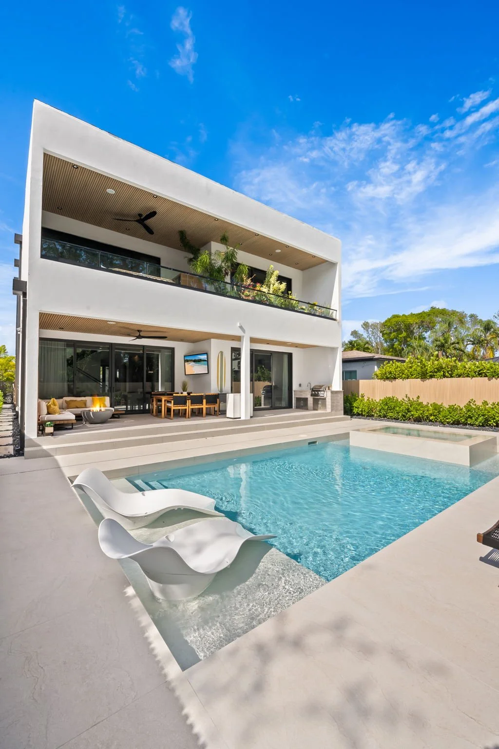 Modern two-story luxury vacation home with private pool — Sun Haven Collection.