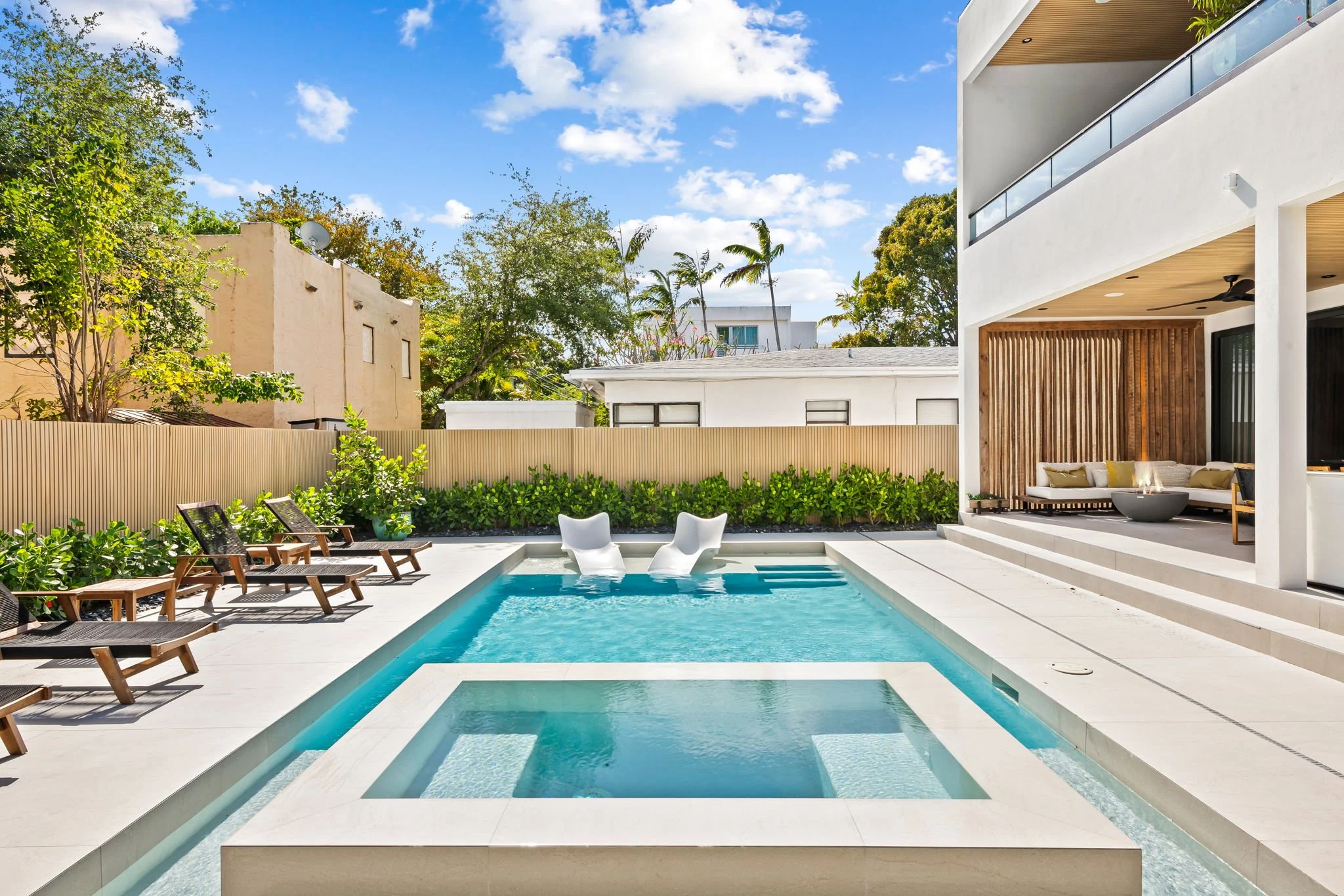 Resort-style backyard with private pool and covered patio — Sun Haven Collection luxury vacation rental.