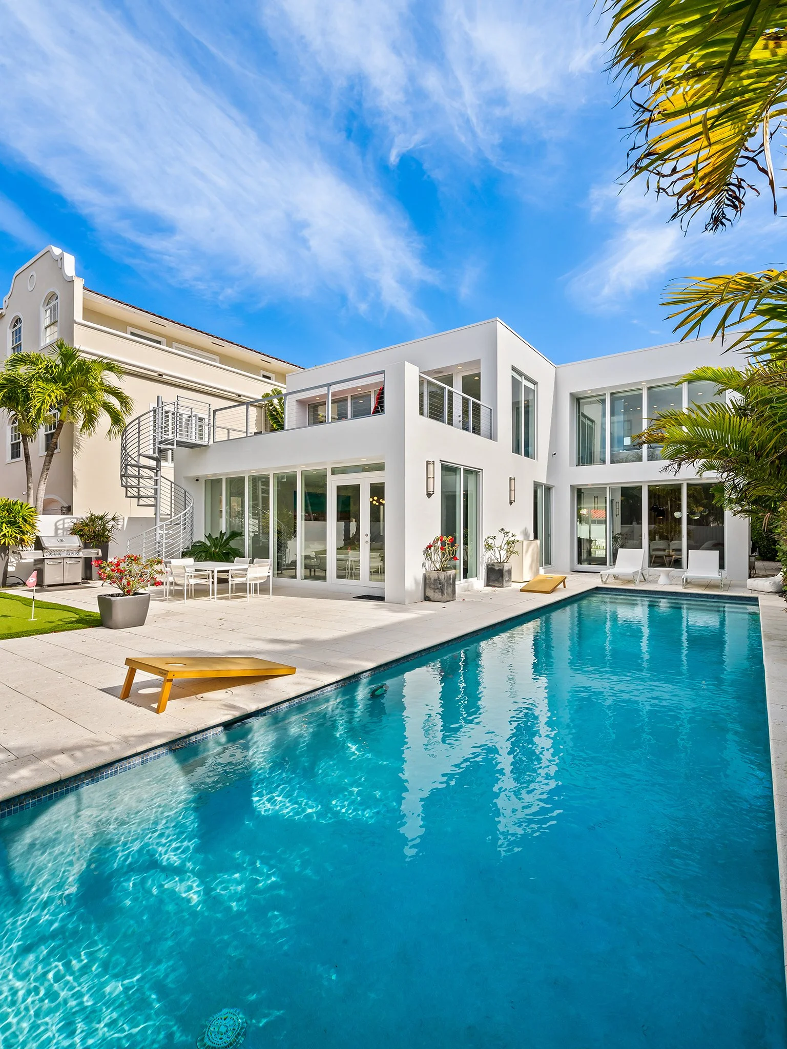 Pool and outdoor lounge at a tropical luxury vacation rental — Sun Haven Collection, Fort Lauderdale.