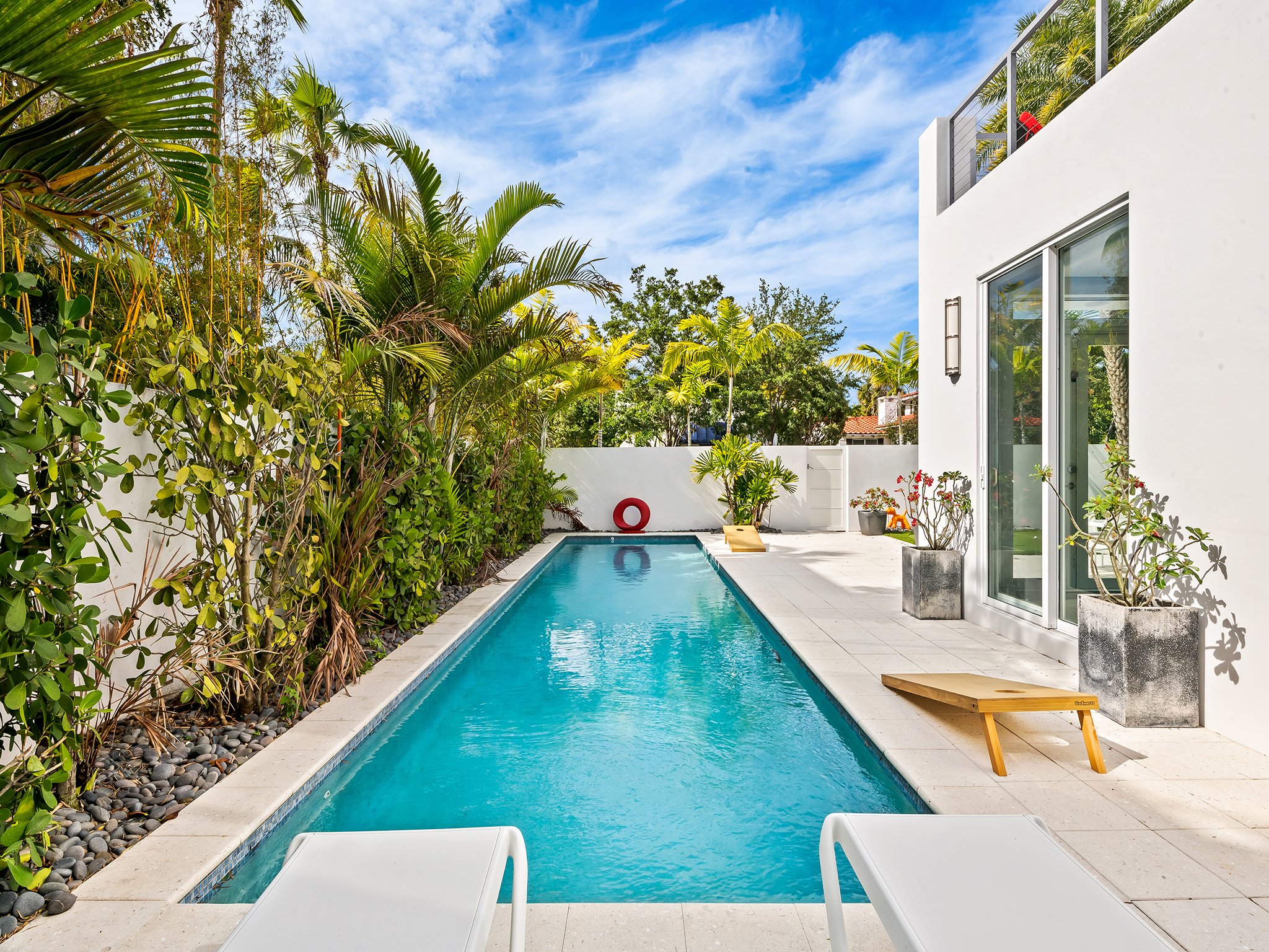 Private pool with sundeck and lounge seating — Sun Haven Collection luxury vacation home, Fort Lauderdale.