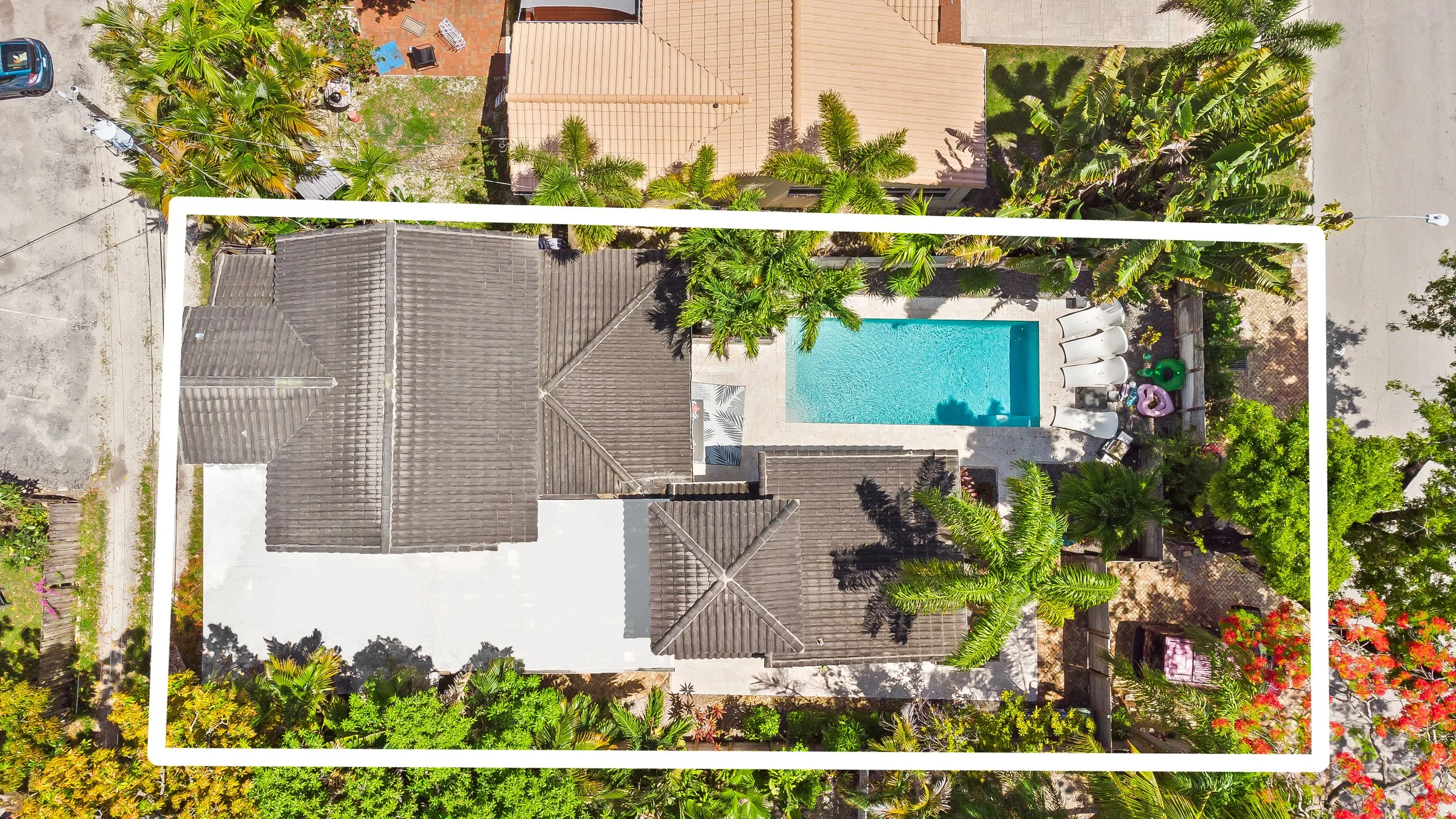 Aerial view of private pool and tropical backyard — Sun Haven Collection luxury vacation home.