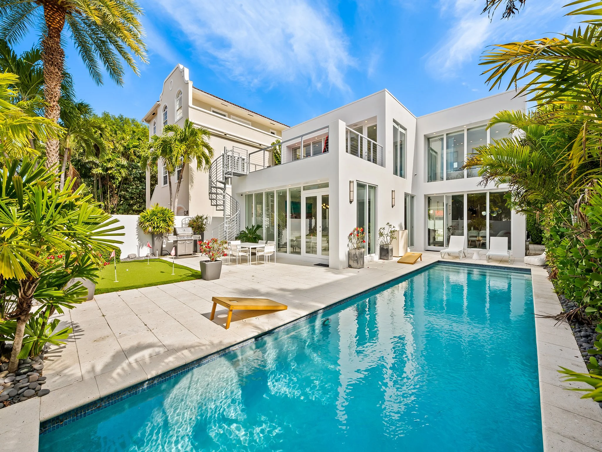 Modern luxury vacation home with pool and tropical landscaping — Sun Haven Collection, Fort Lauderdale.