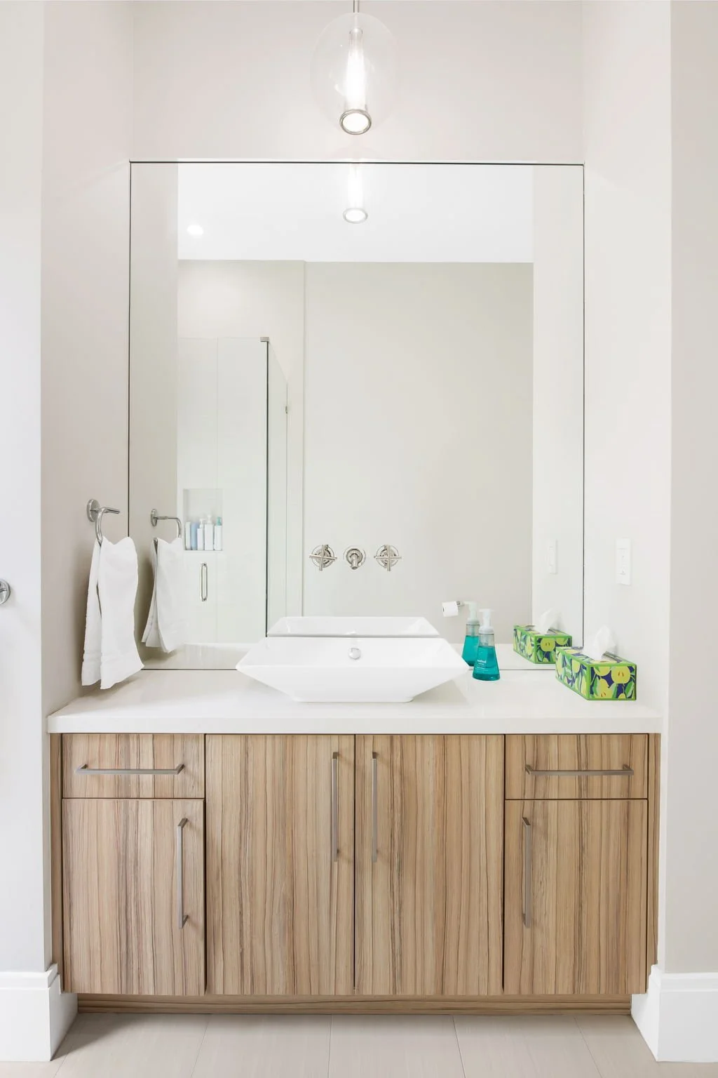 Designer bathroom vanity with vessel sink and premium amenities — luxury vacation home, Sun Haven Collection.