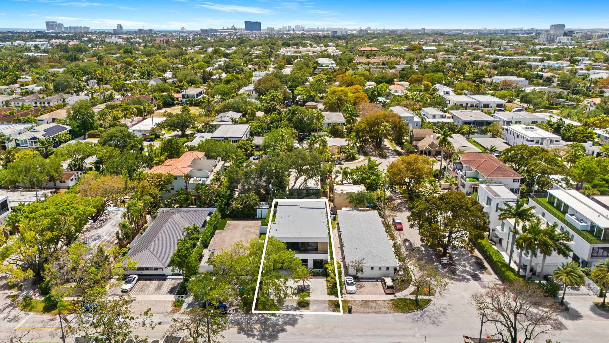 Aerial view of neighborhood near city skyline — Sun Haven Collection luxury vacation rental location.