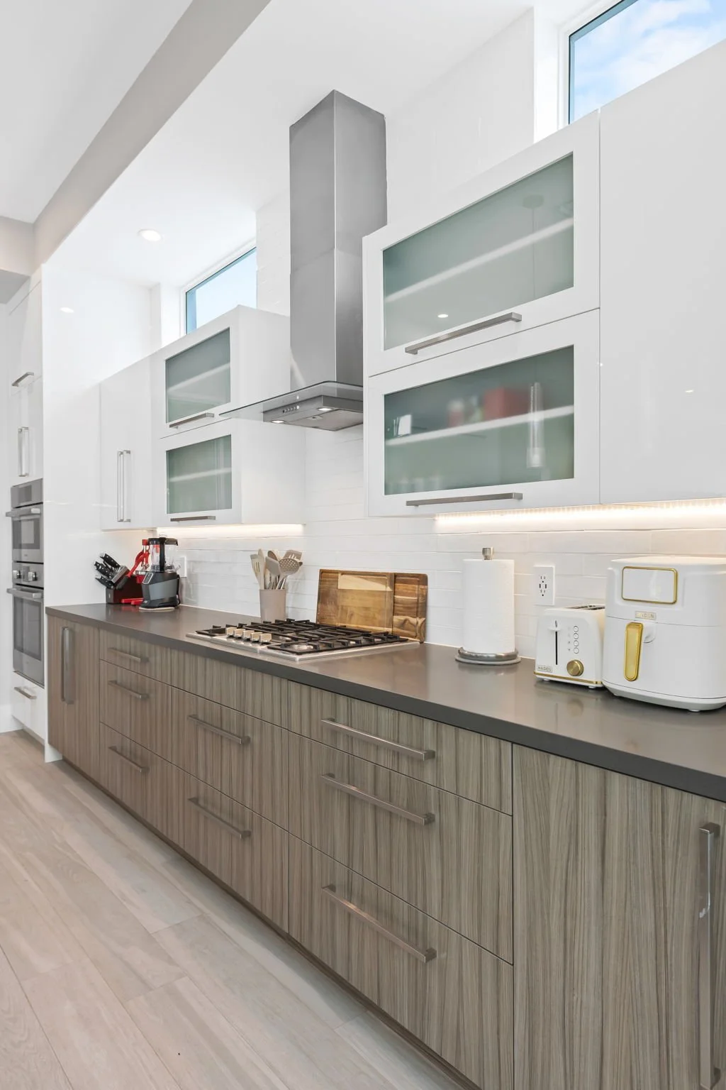 Fully equipped kitchen with range hood and premium appliances — Sun Haven Collection vacation rental.