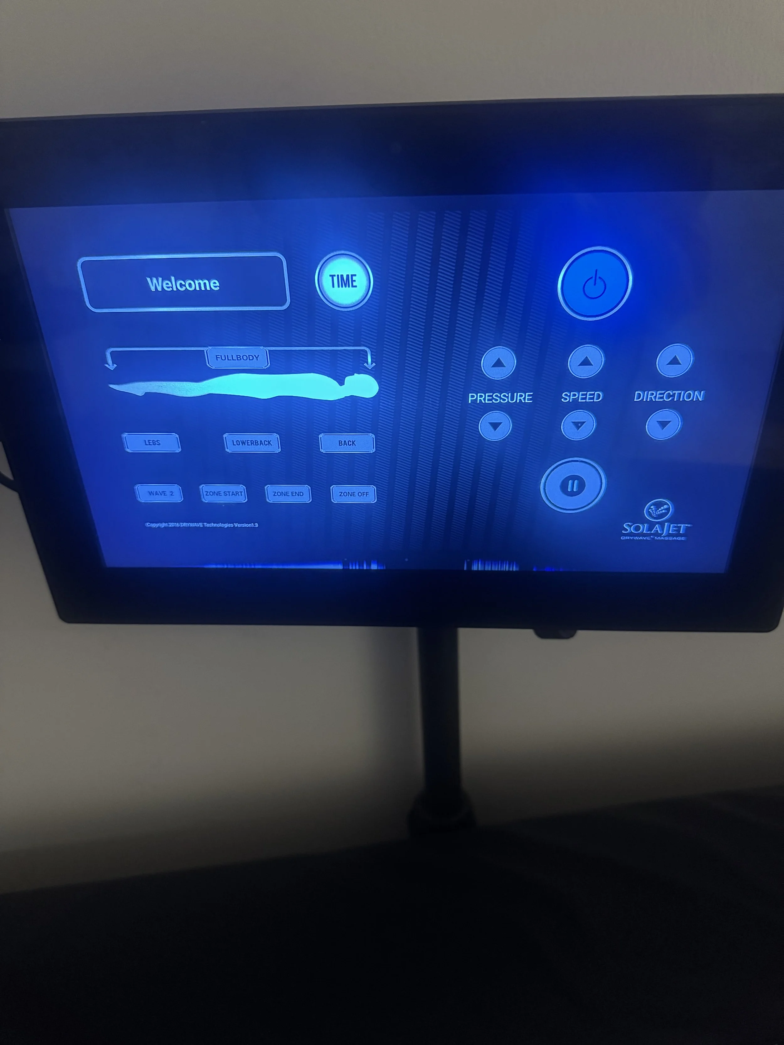 Display screen of a treadmill with options to select workout modes, control speed, pressure, and direction, and start or pause the workout.