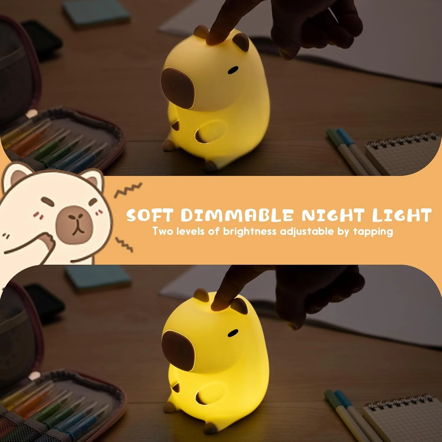 A yellow, dog-shaped night light with brown spots on its ears and body, illuminated softly. The night light is on a wooden table, with a person's finger touching its top. Nearby are a set of colored pens, a mesh pencil case, and a small notepad.
