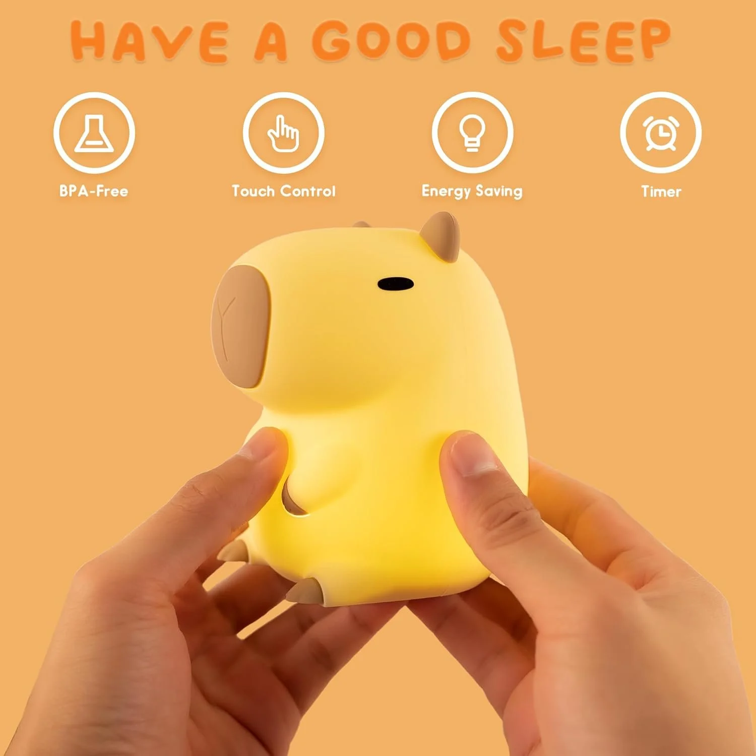 A yellow dog-shaped night light with touch control, energy saving, and timer functions, labeled as BPA-free, held between two hands against an orange background with the text 'Have a good sleep' and icons for features.