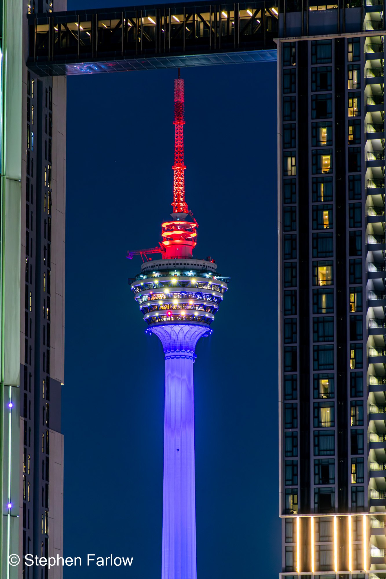 KL Tower framed in an apartment block