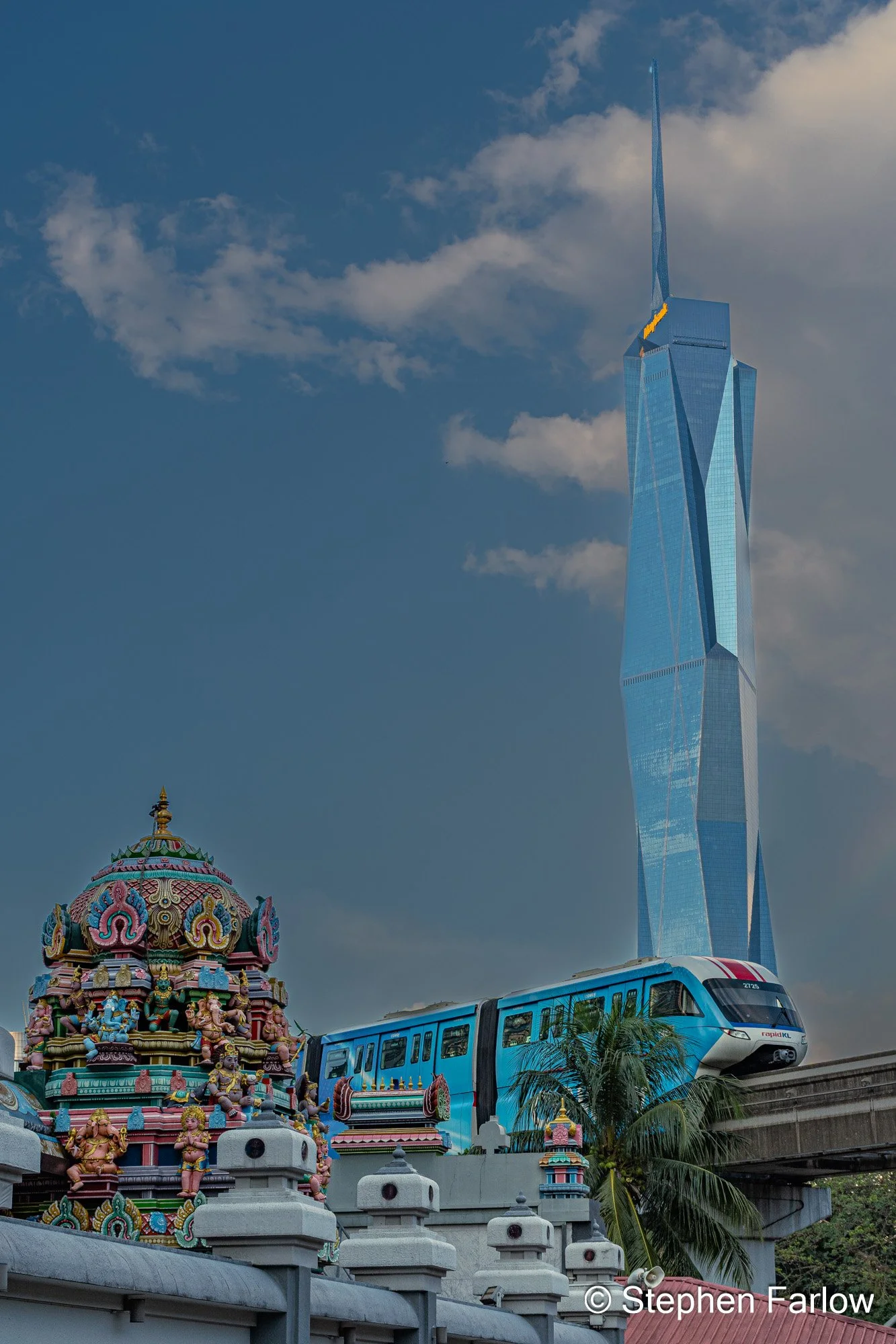 Merdeka 118 with Kandaswarmy Temple and monorail train