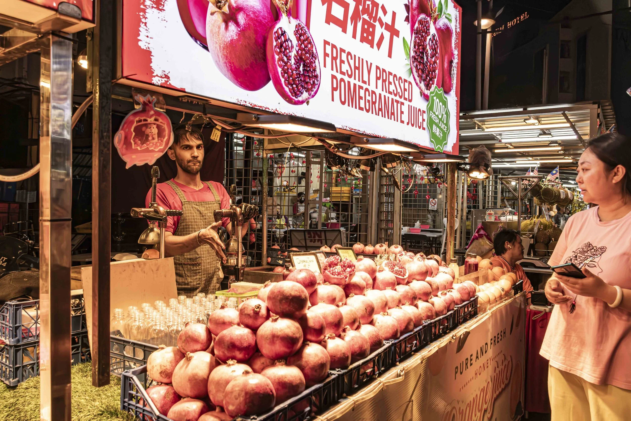 Pomegranate seller in Jalan Alor 