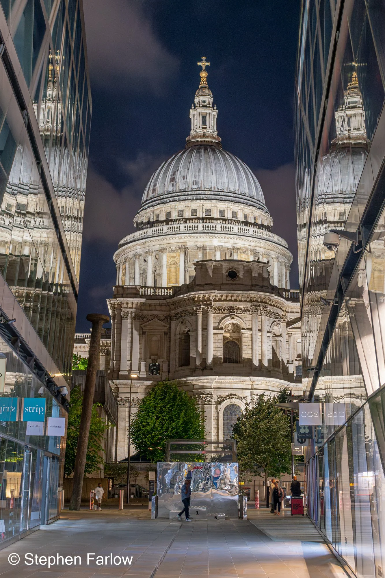 St Paul's Cathedral at night reflected in glass buildings