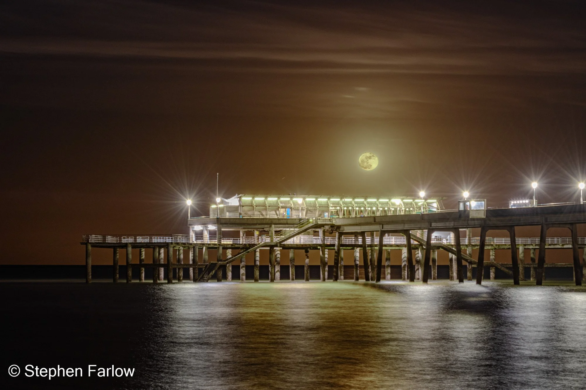 Deal pier with full moon