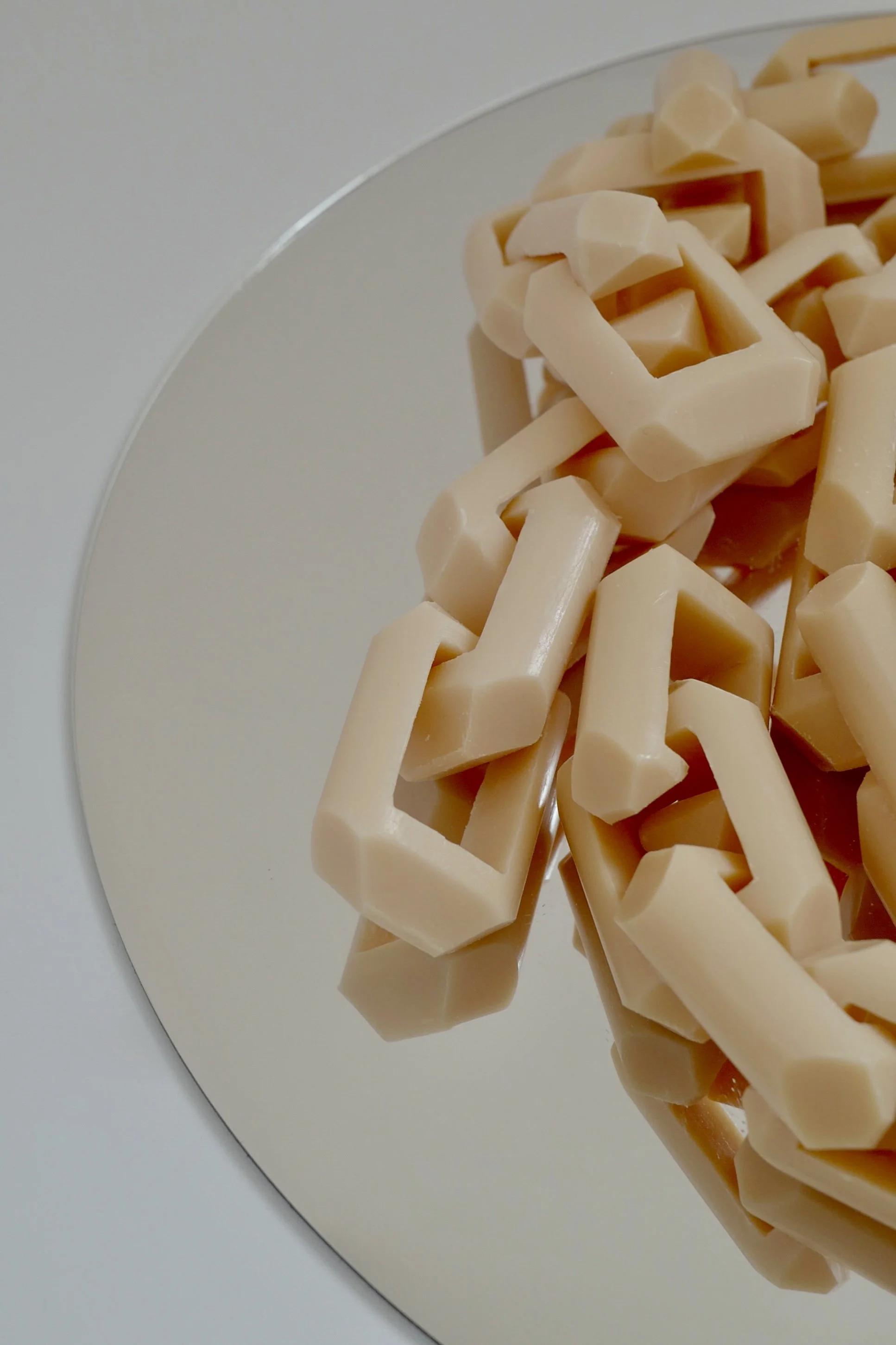 A close up detail shot of the carved bars of soap, displaying markings from the making.