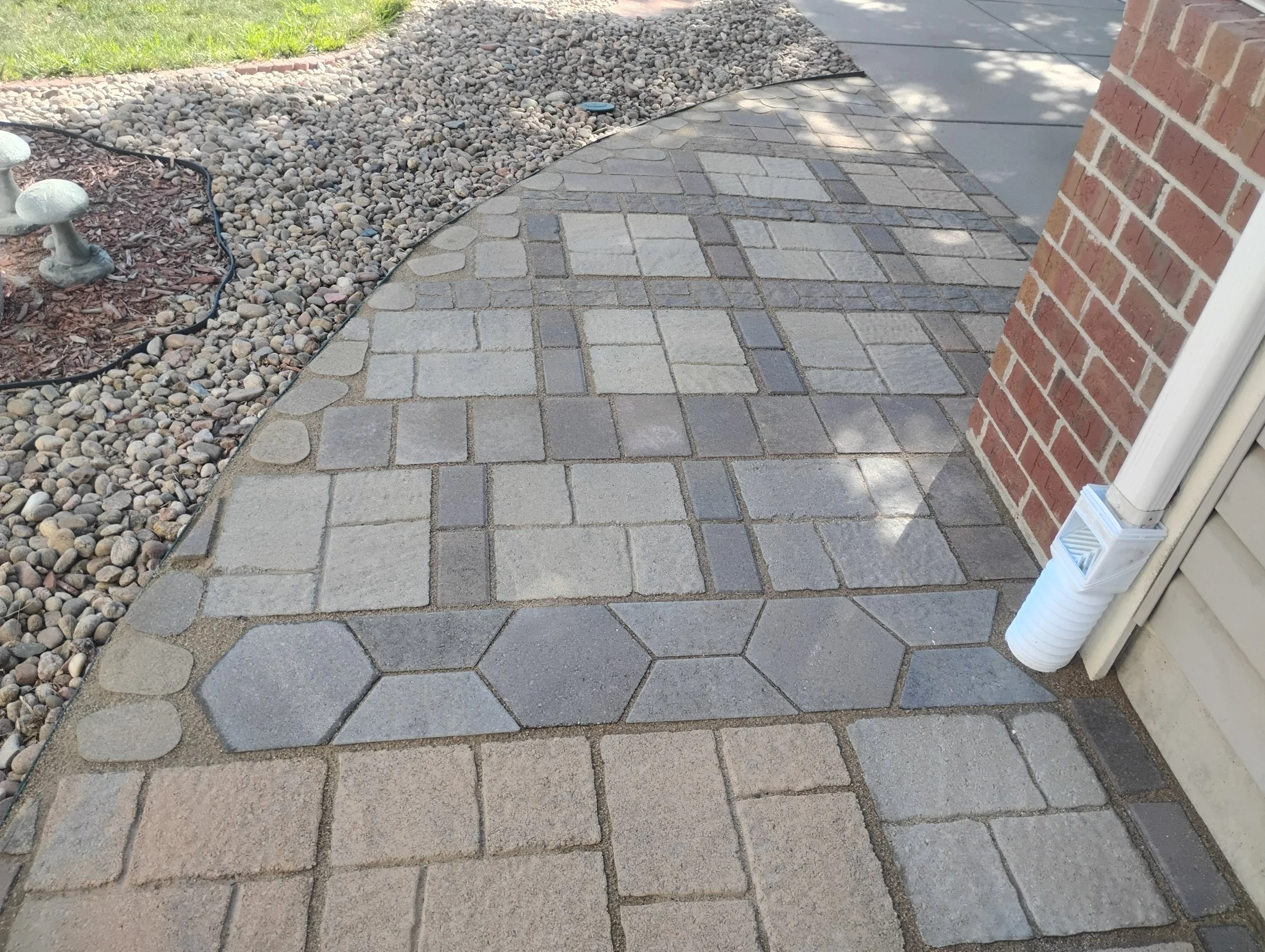 Assorted bricks and pavers, arranged into a beautiful walkway.