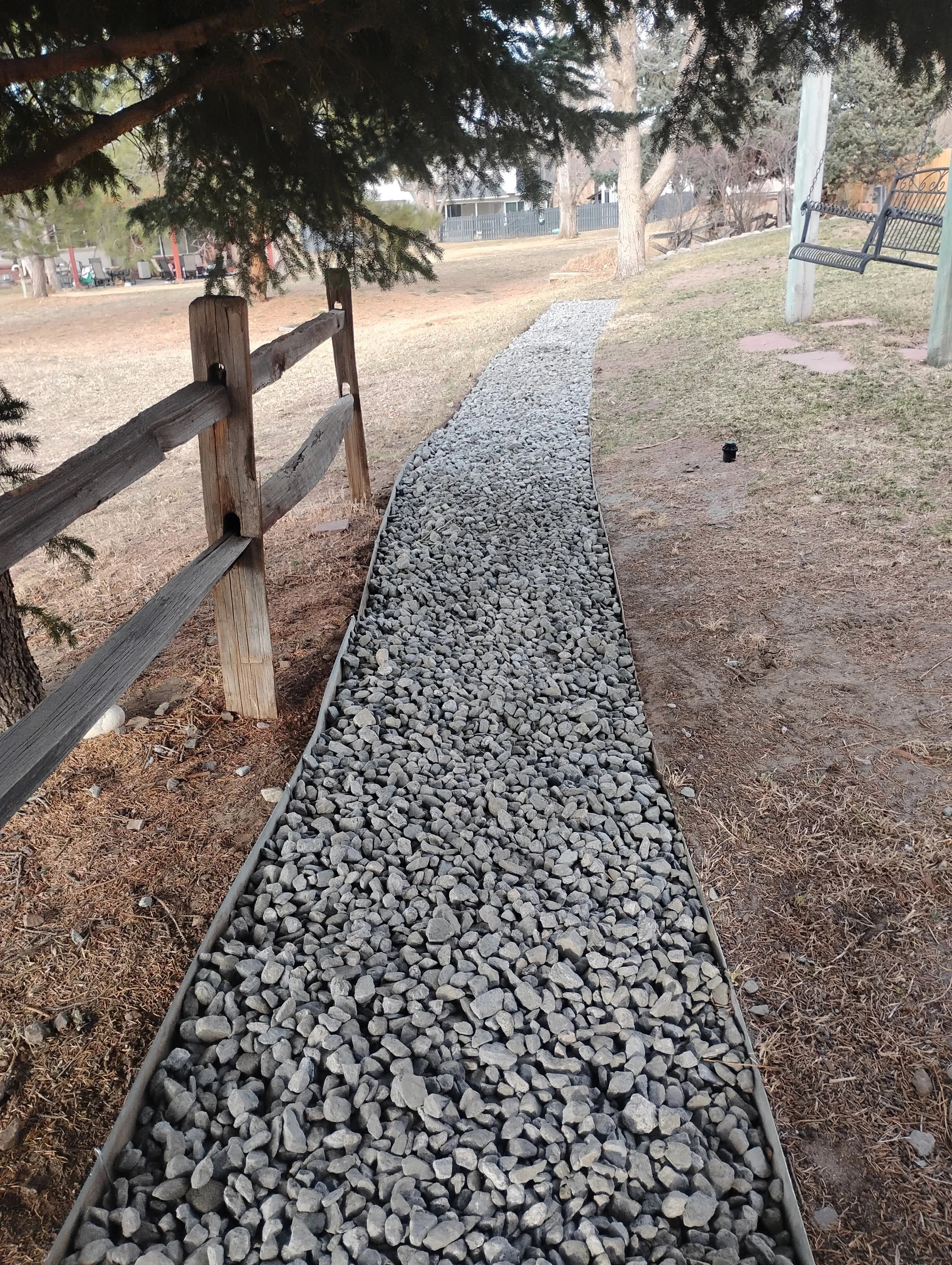 New rock-bed around a backyard.