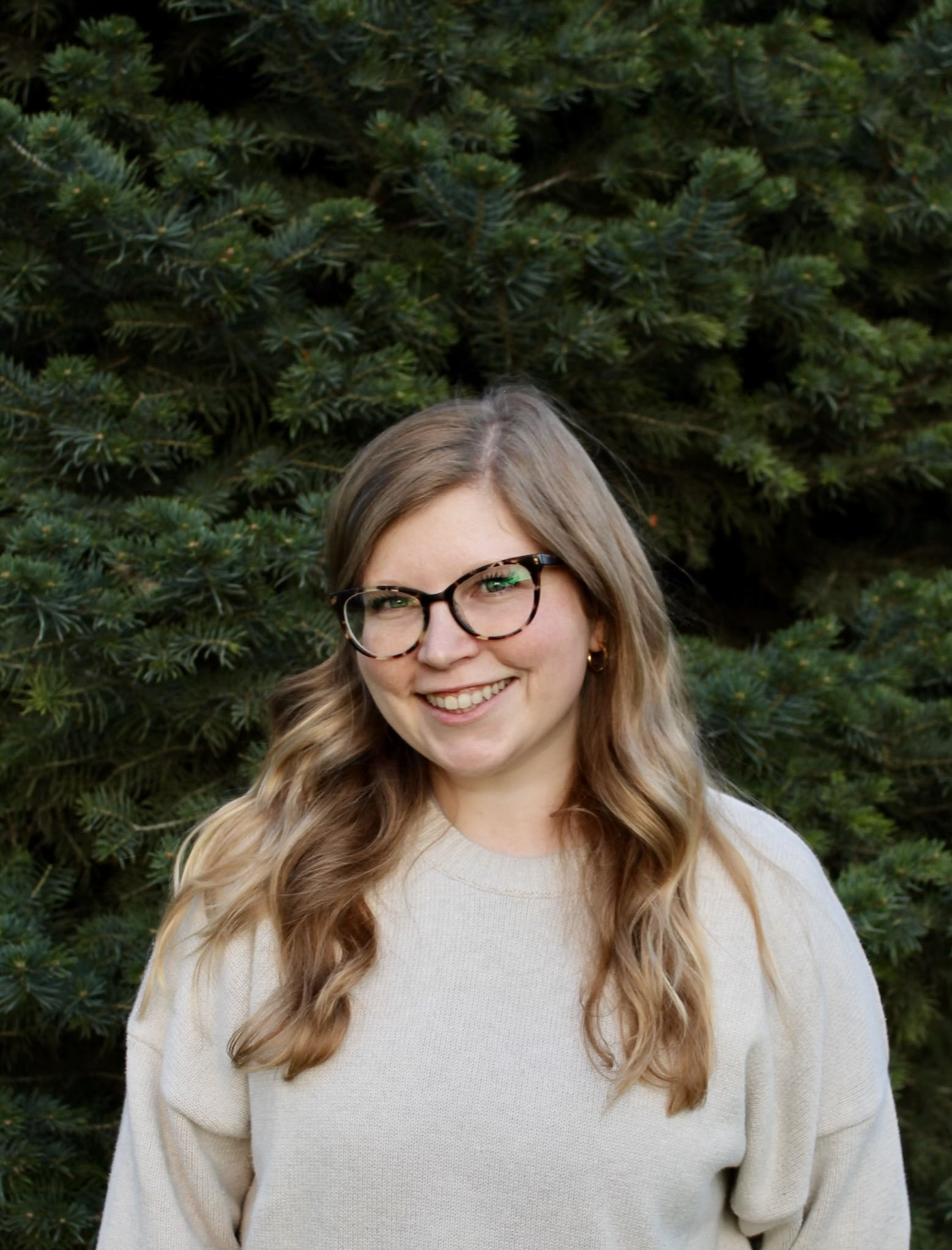 Kelsey McCamon, LPC, smiling outdoors