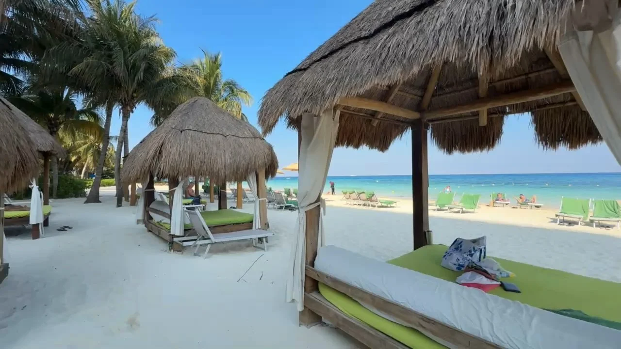 Beach chairs at Meliá Cozumel The Level with clear turquoise water