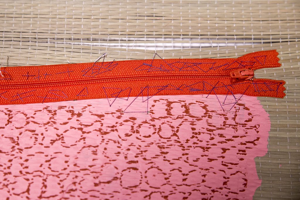 Mat, zipper, latex paint, oil and string