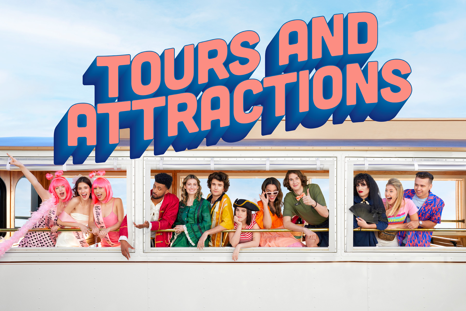 Group of people dressed in colorful costumes and accessories, standing inside a sightseeing bus, with a blue sky background and a large sign reading 'Tours and Attractions' above.