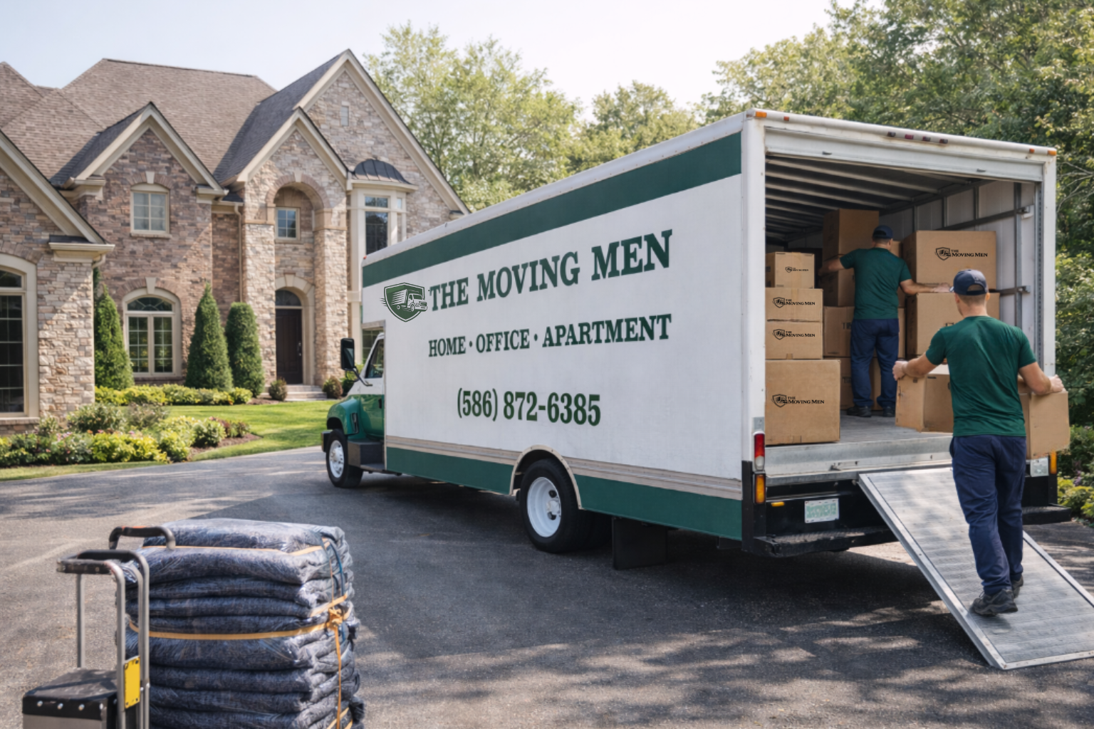 Professional movers unloading household items during a residential move in Metro Detroit, Michigan