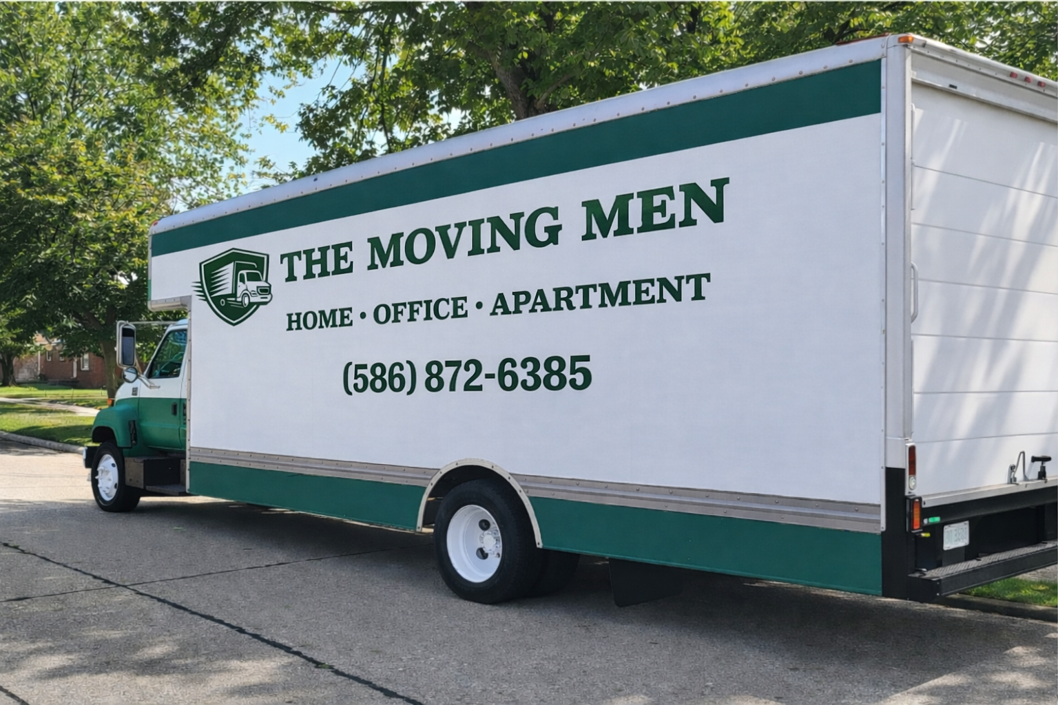 “The Moving Men moving truck providing residential and commercial moving services in Metro Detroit, Michigan, parked in a suburban neighborhood.”