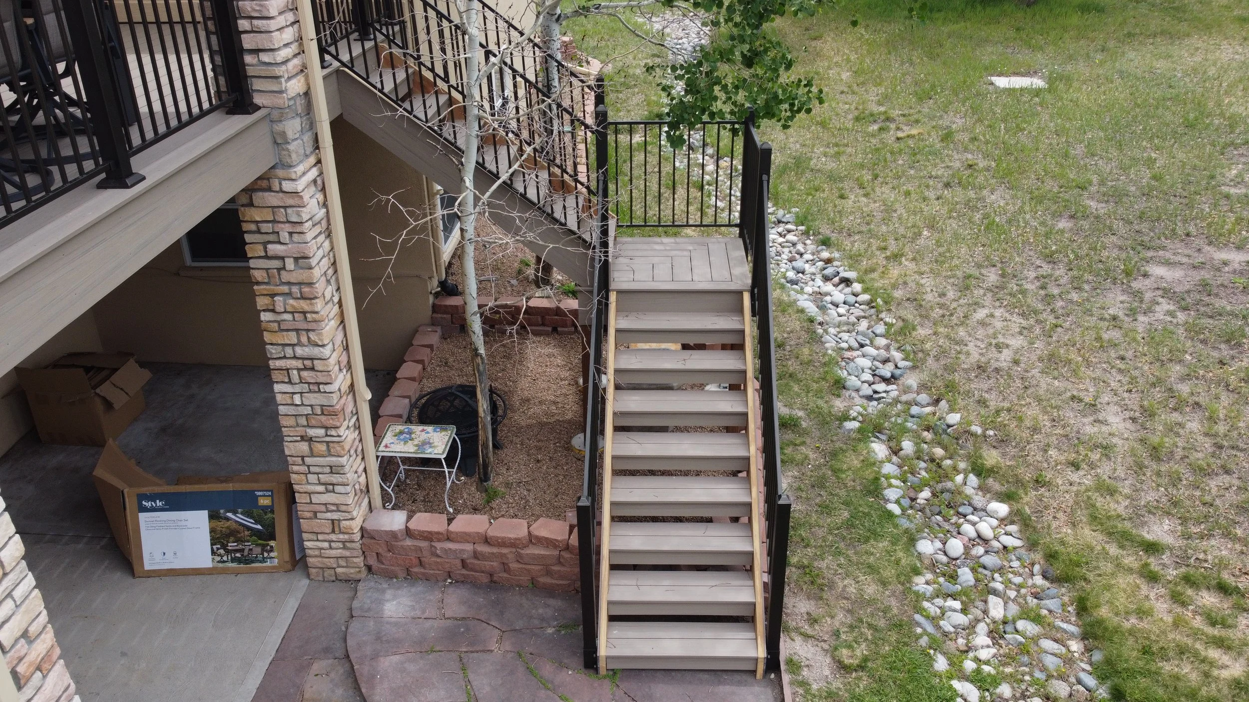 Custom Stair Lock Tread stairs with haring bone mid-lnding with outside mount fortress railing. Beautifull Deck stairs  Outdoor living space. Deck Builder Specialist in Douglass County Colorado, Castle Rock, Larkspur, Palmer Lake, Parker, Hylands Ran
