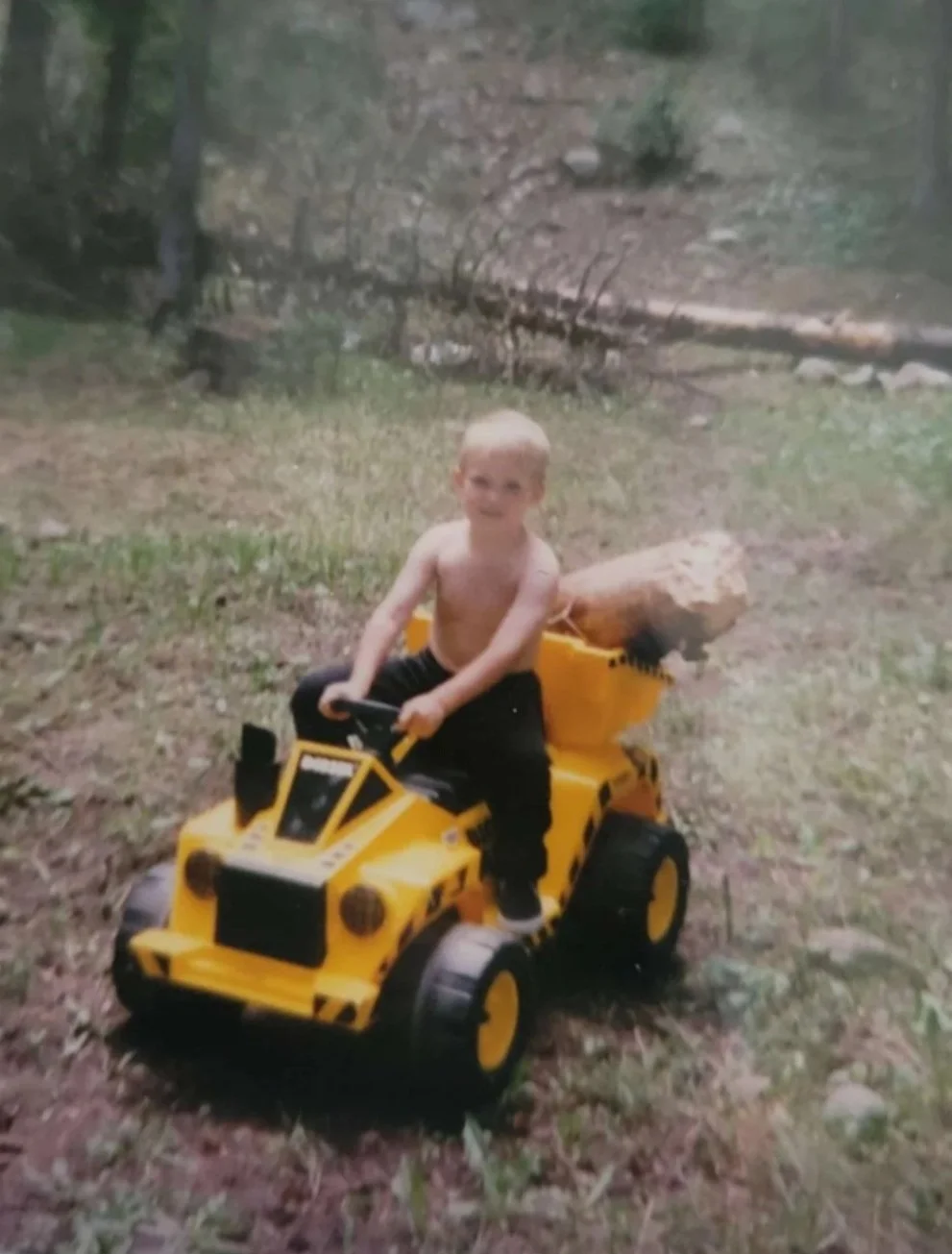 Owner Mile High Decks Cole Riding his dumptruck as a kid