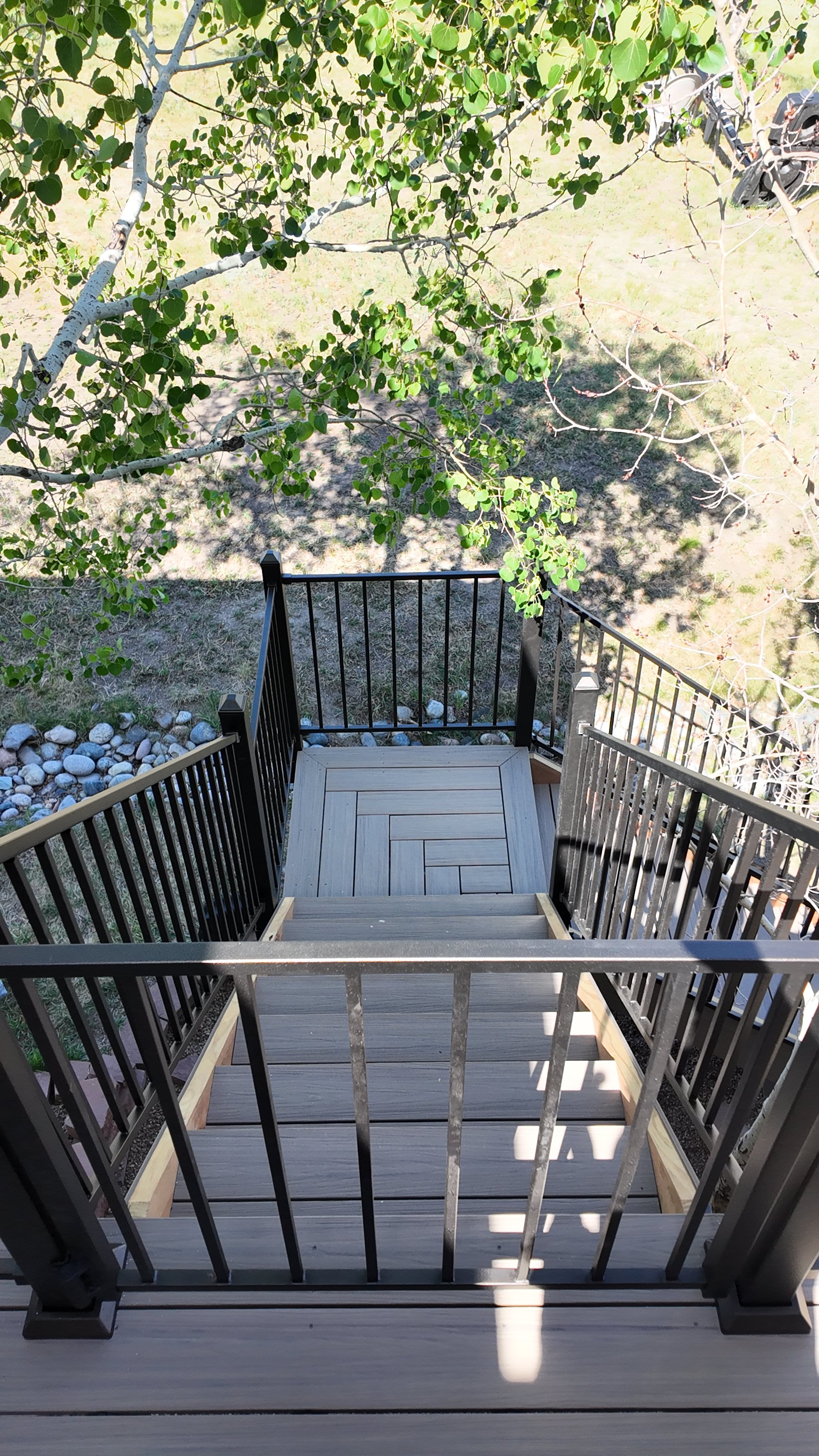 Fortress Deck railing with gate and haring bone mid-landing  Outdoor living space. Deck Builder Specialist in Douglass County Colorado, Castle Rock, Larkspur, Palmer Lake, Parker, Hylands Ranch, Littleton, Evergreen, Franktown Colorado Mile High Deck
