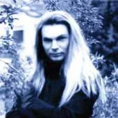 Tracie Law, singer with Symphony of Pain, with long blonde hair standing outdoors for the cover shoot of the EP Eschatology.