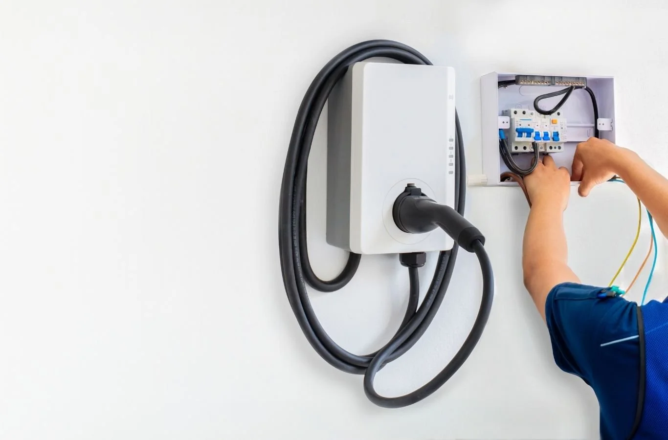 Collins Electric expert wiring an EV charger in Healdsburg, CA with careful planning. EV Charger Installation Near Me.