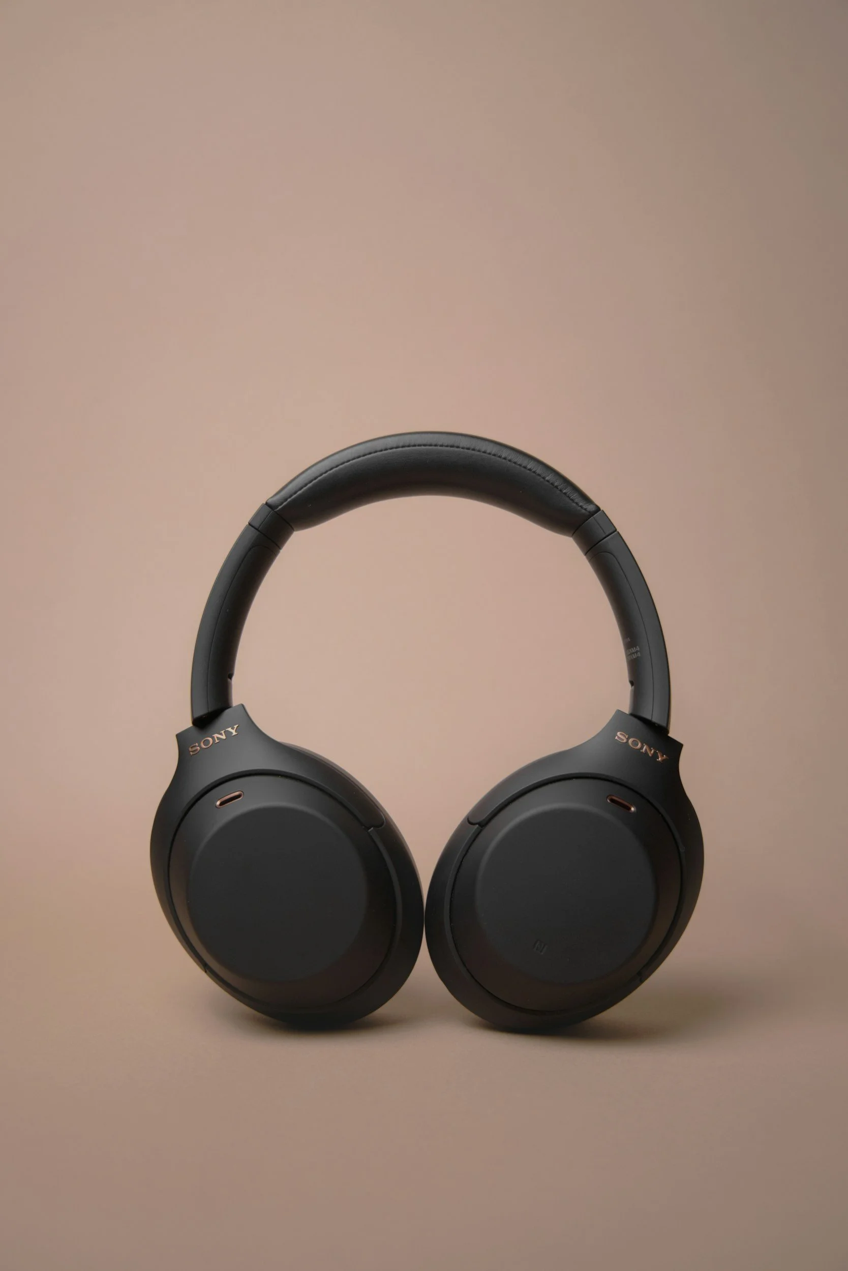 Headphones representing an audio-first personal growth podcast for women focused on gentle life experiments
