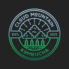 Circular logo with cloud, mountain, and trees illustrations, featuring text 'Cloud Mountain Kombucha' and 'Est. 2021'.