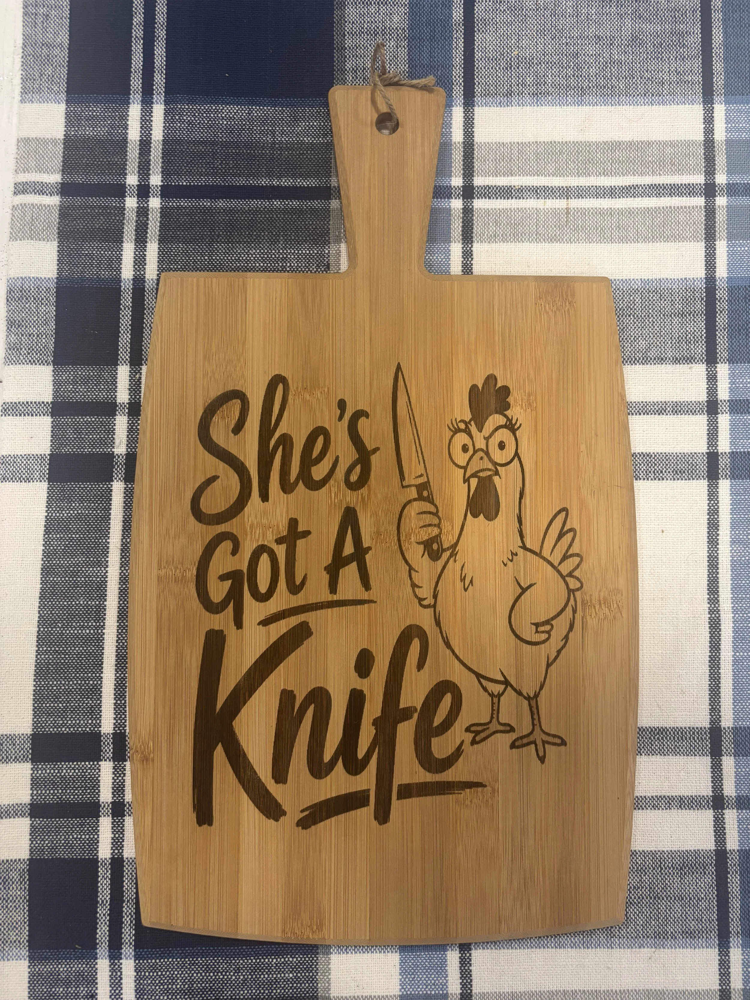 She's Got A Knife (Cutting Board).jpeg