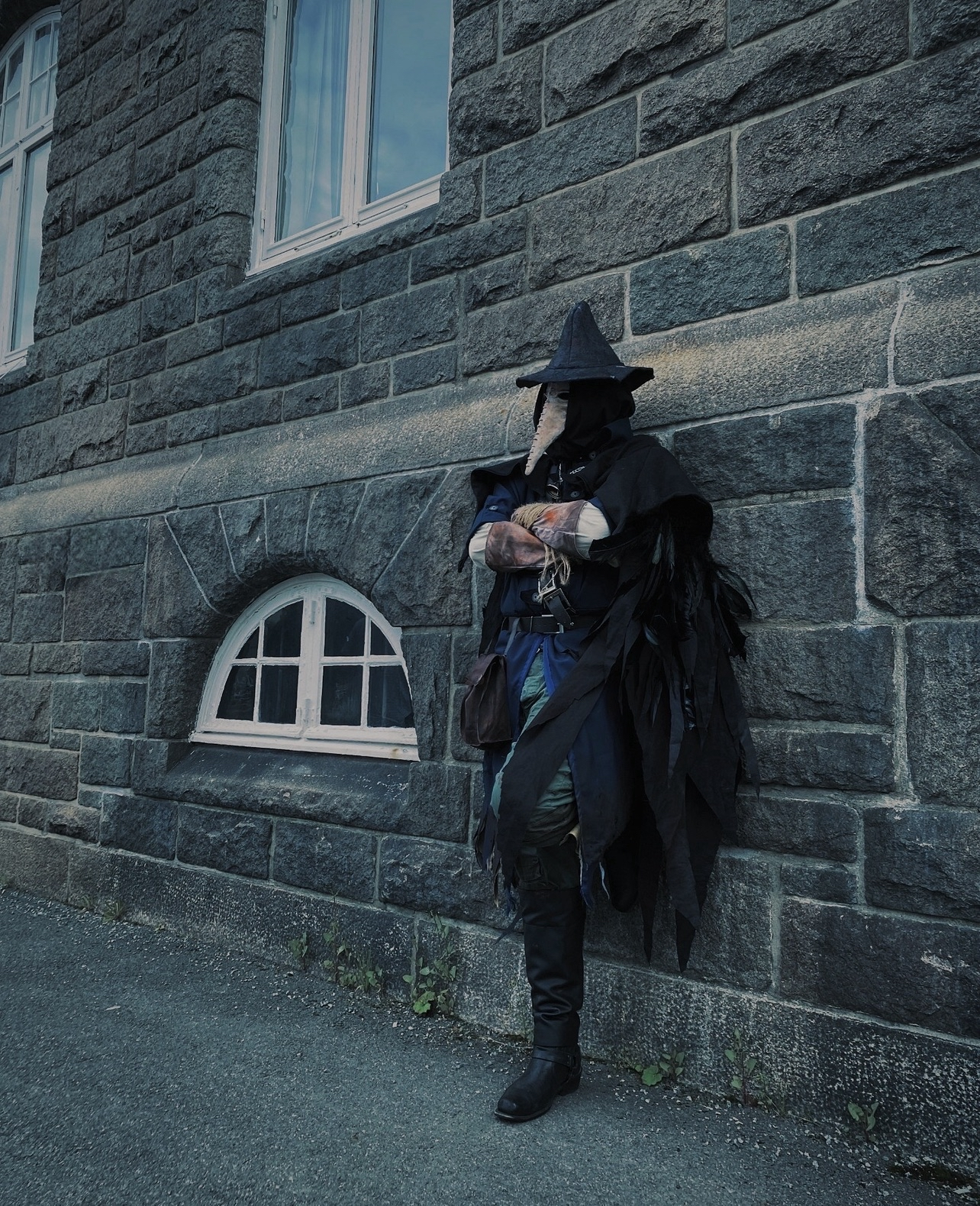 Eileen the Crow from Bloodborne (2015) 
The cape was made from a mix of fabric and bird feathers.