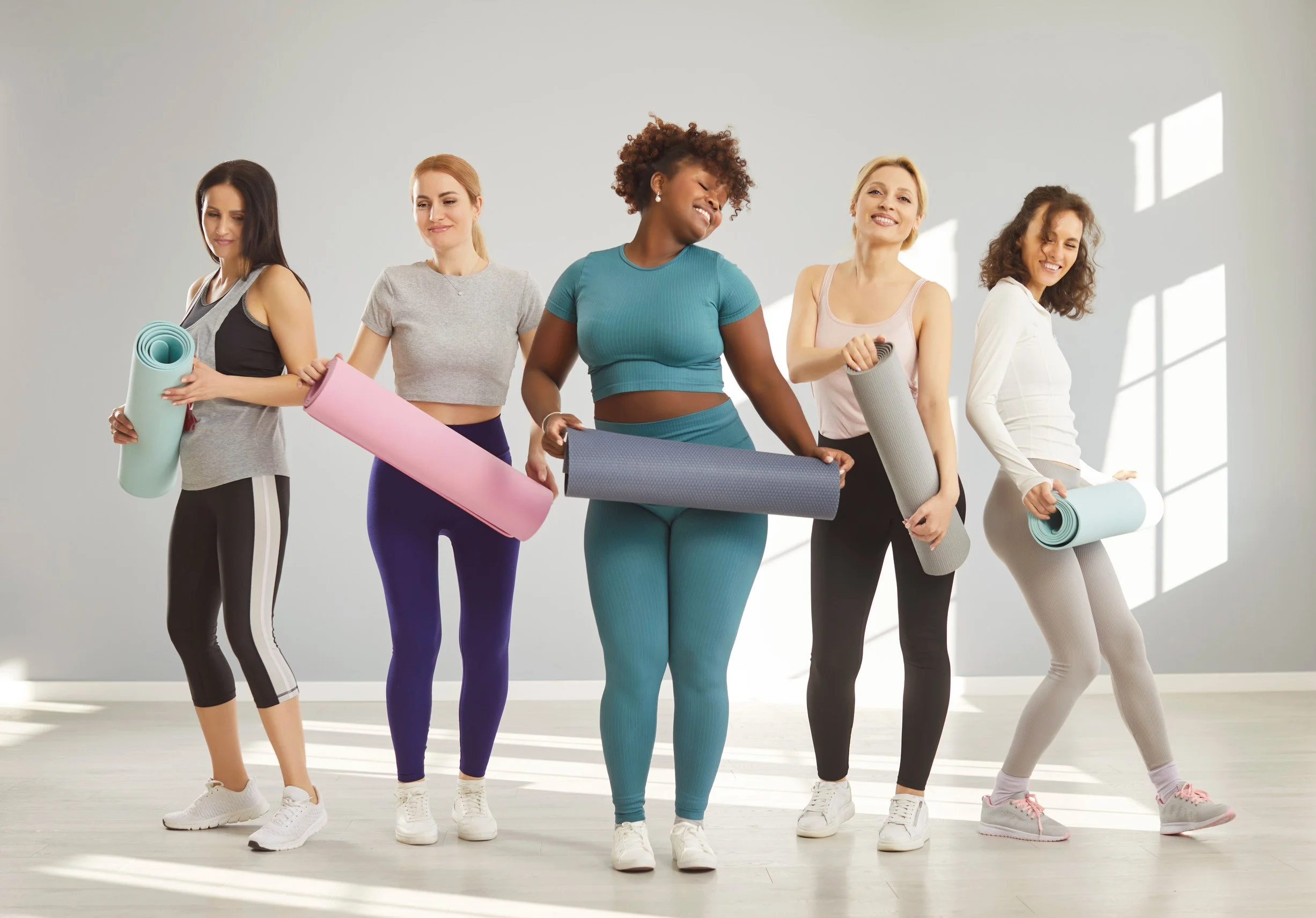 Dana Wyss Health & Movement Classes Women with Exercise Mats Ready for Class