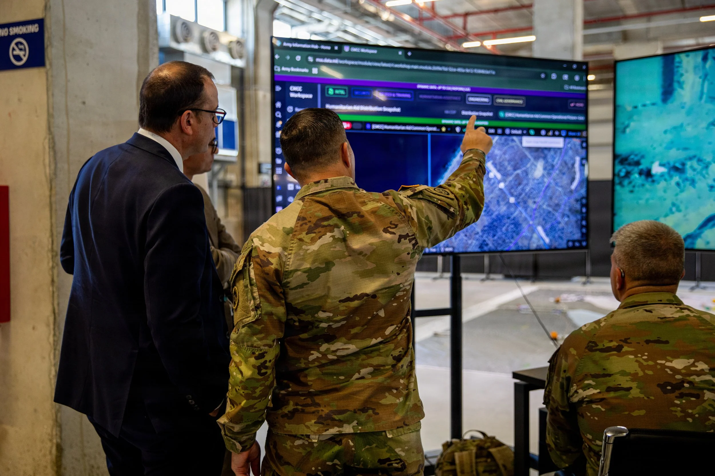 U.S. Army Soldiers assigned to U.S. Army Central and representatives of Non-Government Organization’s (NGO) analyze humanitarian aid routes in the Civil-Military Coordination Center (CMCC) on Nov. 24, 2025, in Israel. The CMCC is designed to help fac