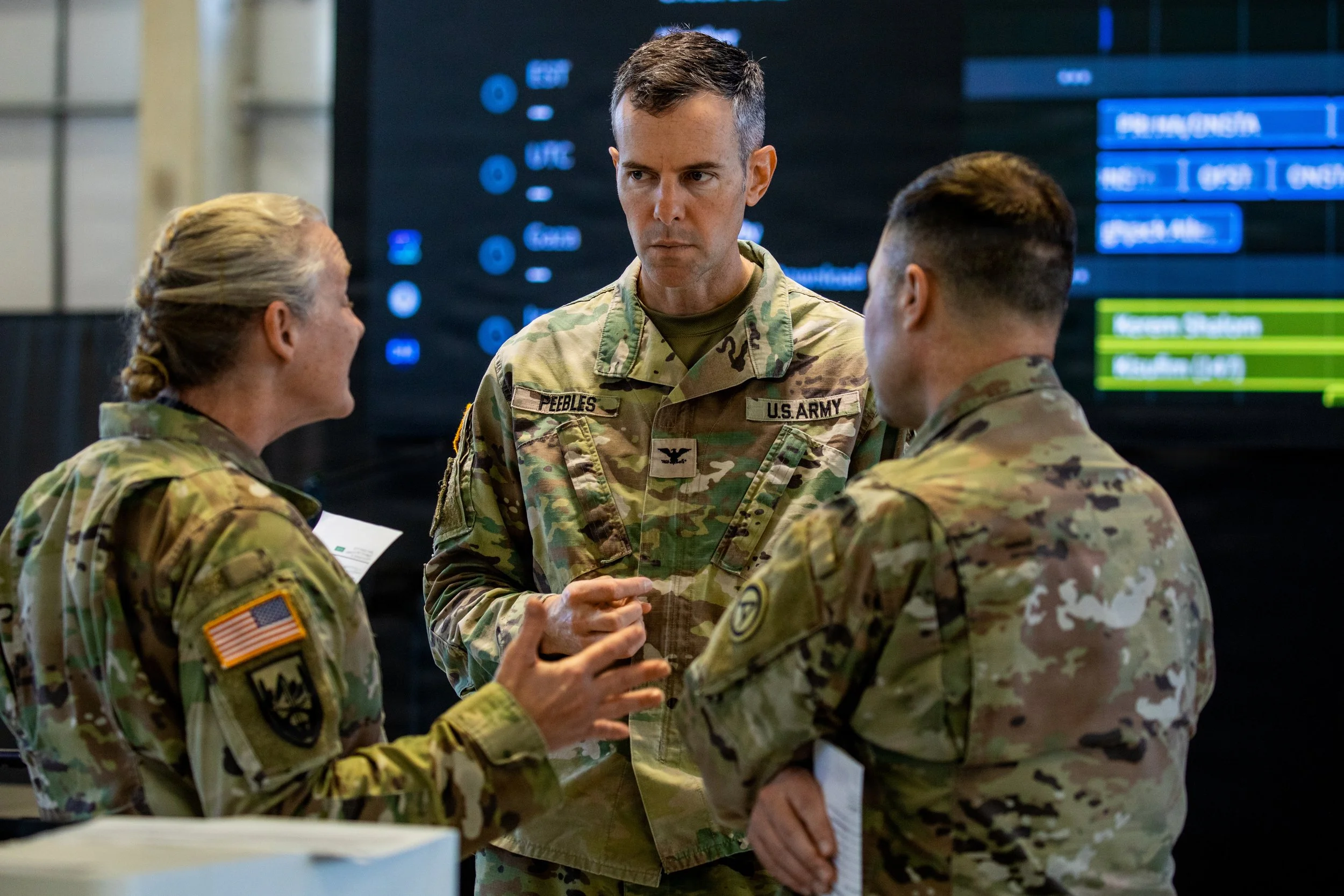 Soldiers assigned to U.S. Army Central discuss humanitarian aid operations inside the Civil-Military Coordination Center (CMCC) on Nov. 22, 2025, in Israel. The CMCC is designed to help facilitate the flow of humanitarian, logistical, and security as