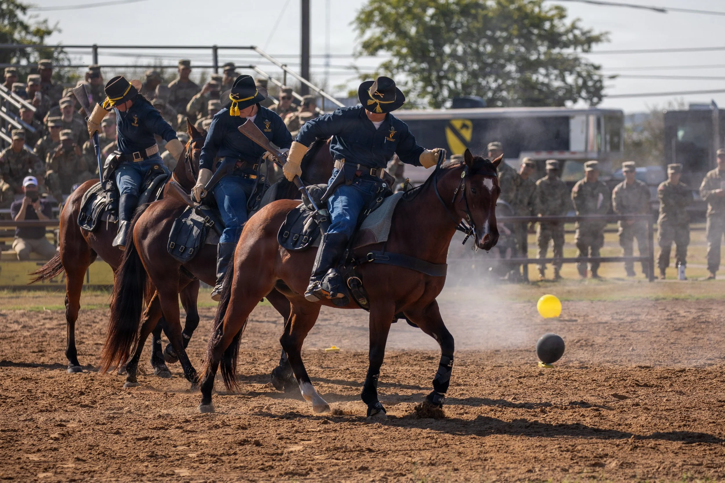 U.S. Army Troopers with the Horse Cavalry Detachment, 1st Cavalry Division, holster their 1875 Model 45-70 Springfield Carbines during a mounted cavalry demonstration at the detachment riding arena at Fort Hood, Texas, Oct. 2, 2025. The detachment us