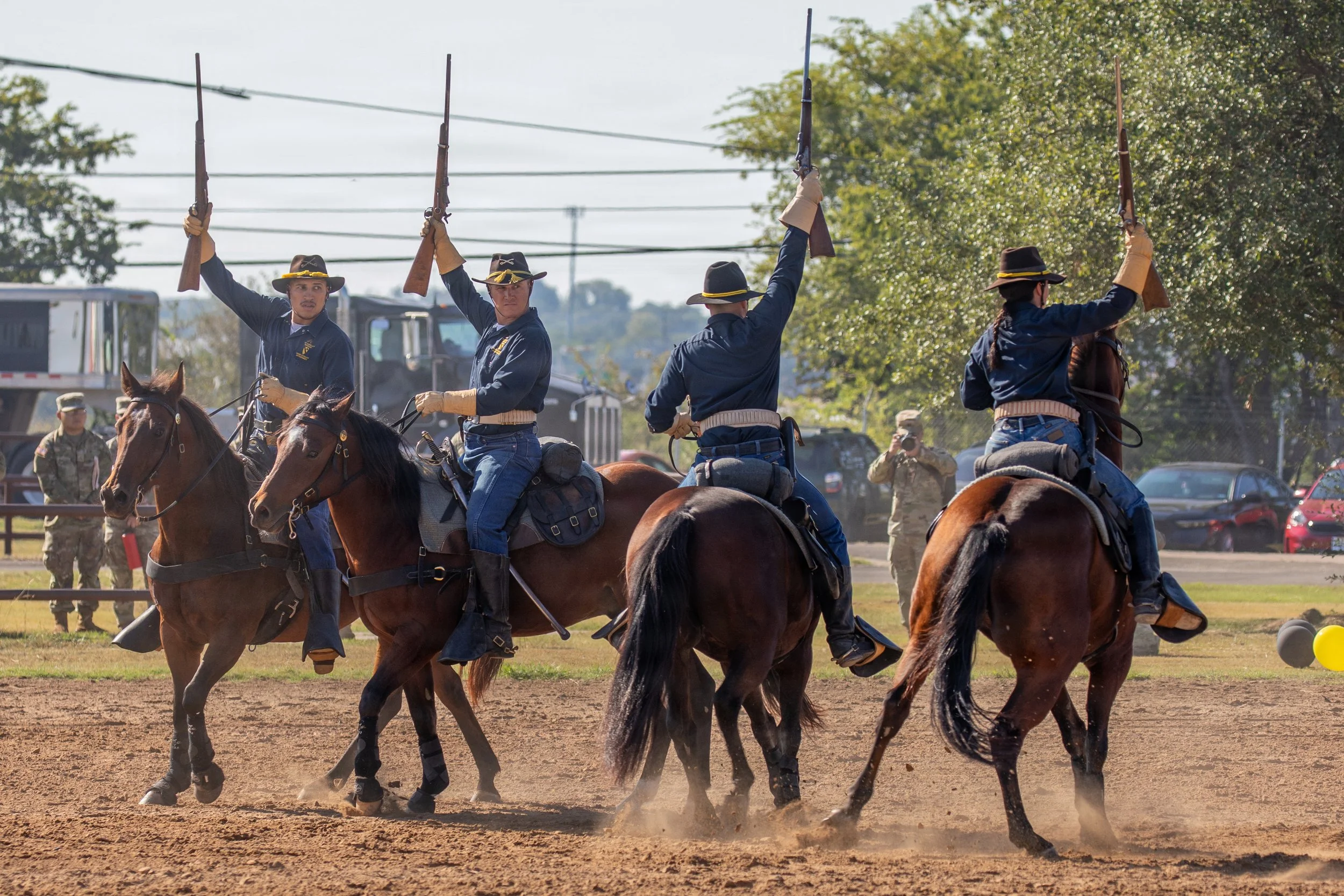 U.S. Army Troopers with the Horse Cavalry Detachment, 1st Cavalry Division, wield 1875 Model 45-70 Springfield Carbines in a mounted cavalry demonstration at Fort Hood, Texas, Oct. 2, 2025. The detachment preserves historical military traditions and 
