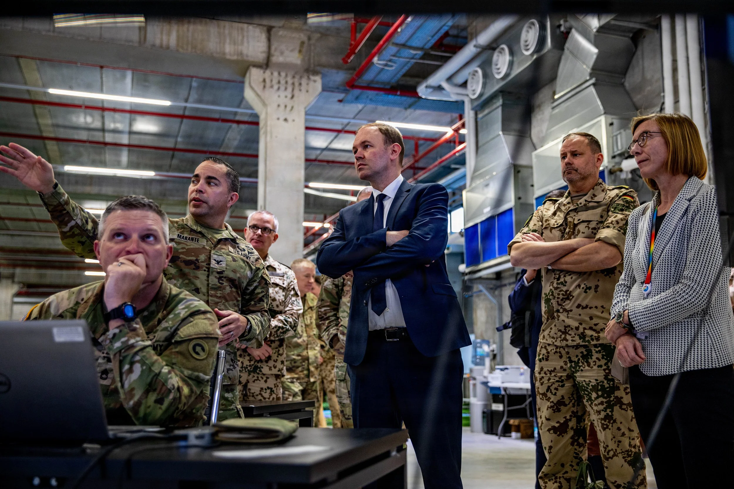 KIRYAT GAT, Israel -- U.S. Army Col. Anthony Marante, officer in charge of the humanitarian assistance current operations section, talks with Nils Hilmer, German State Secretary at the Federal Ministry of Defence, about humanitarian assistance route 
