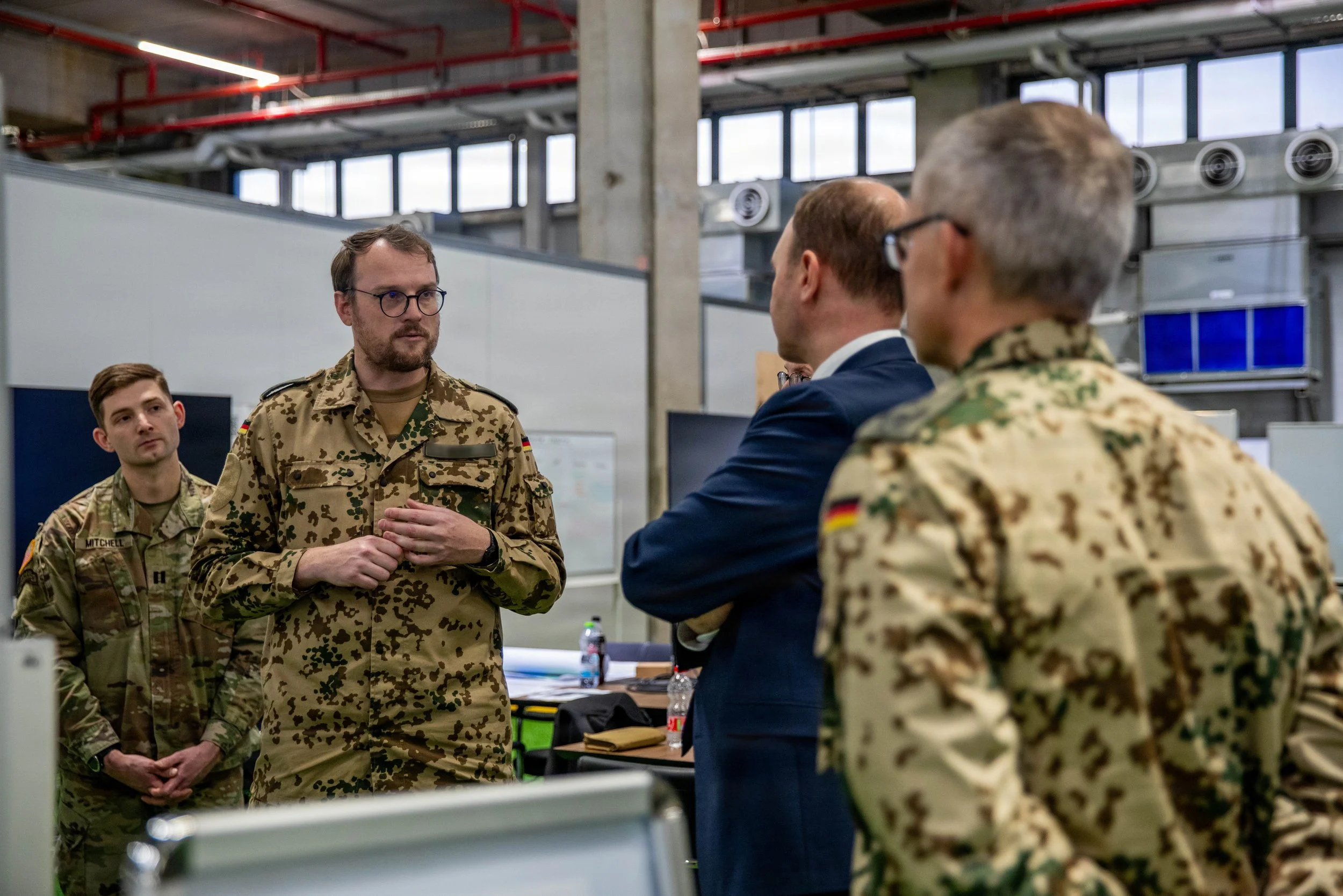 KIRYAT GAT, Israel -- Nils Hilmer, German State Secretary at the Federal Ministry of Defence, speaks with members of the Bundeswehr, as well as U.S. Army Soldiers assigned to U.S. Army Central during a visit to the Civil-Military Coordination Center 