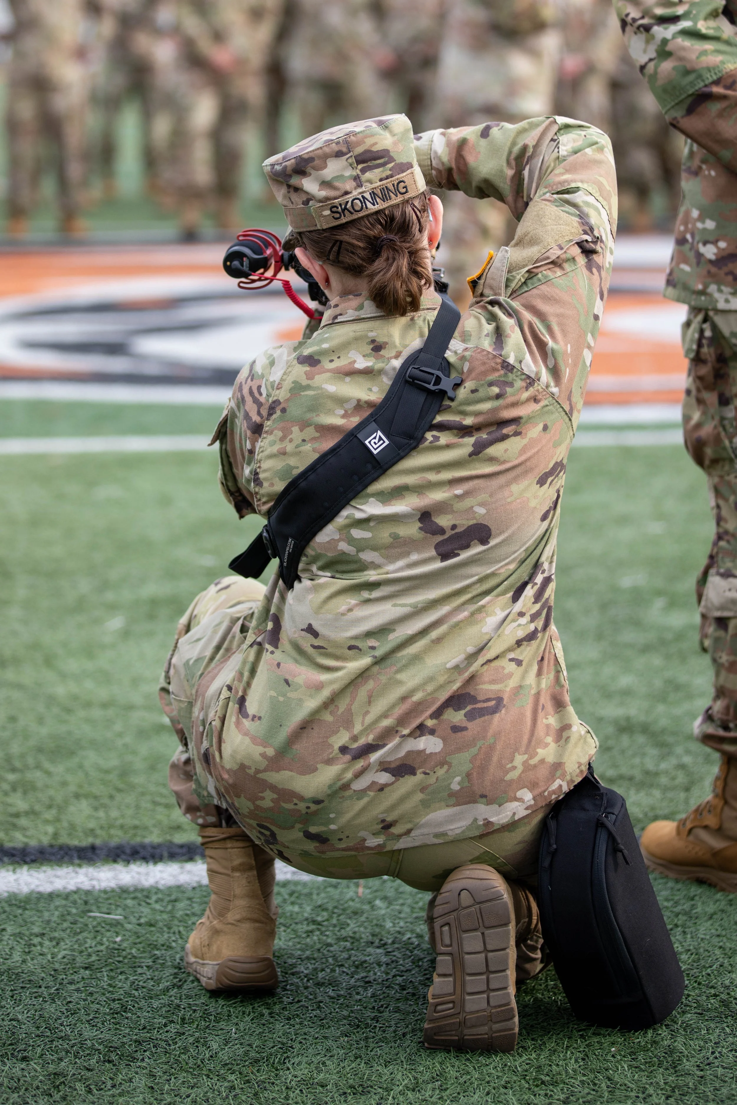Photo of Kathryn Skonning taking pictures in her role as a Public Affairs Mass Communication Specialist for the U.S. Army Reserve. Image taken on August 16, 2025.
