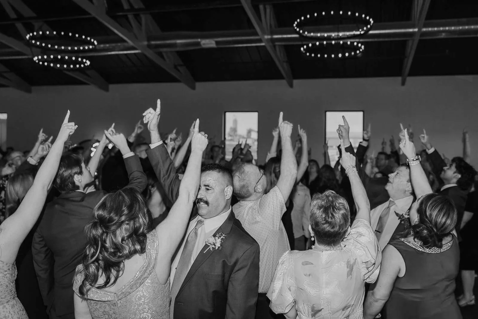 Dance floor full of people dancing at a wedding
