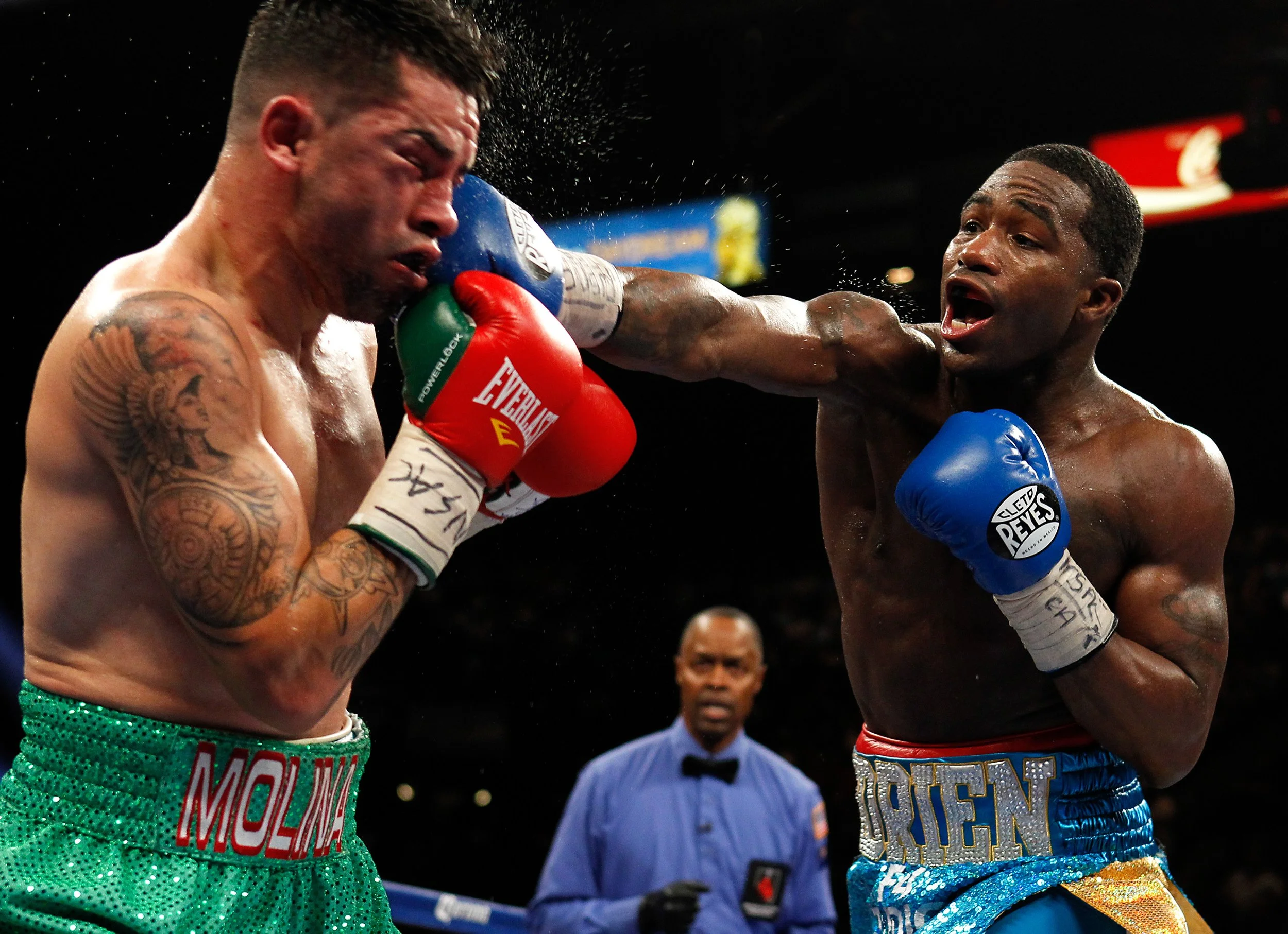 Boxer Adrien Broner, right, connects against Carlos Molina during their Super Lightweight title bout at the MGM Grand Garden Arena in Las Vegas Saturday, May 3, 2014.