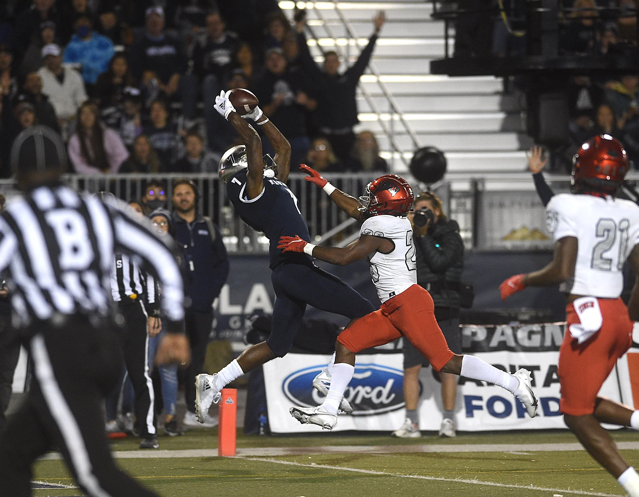 Nevada's Romeo Doubs makes a catch for a touchdown while taking on UNLV at Mackay Stadium in Reno on Oct. 29, 2021.