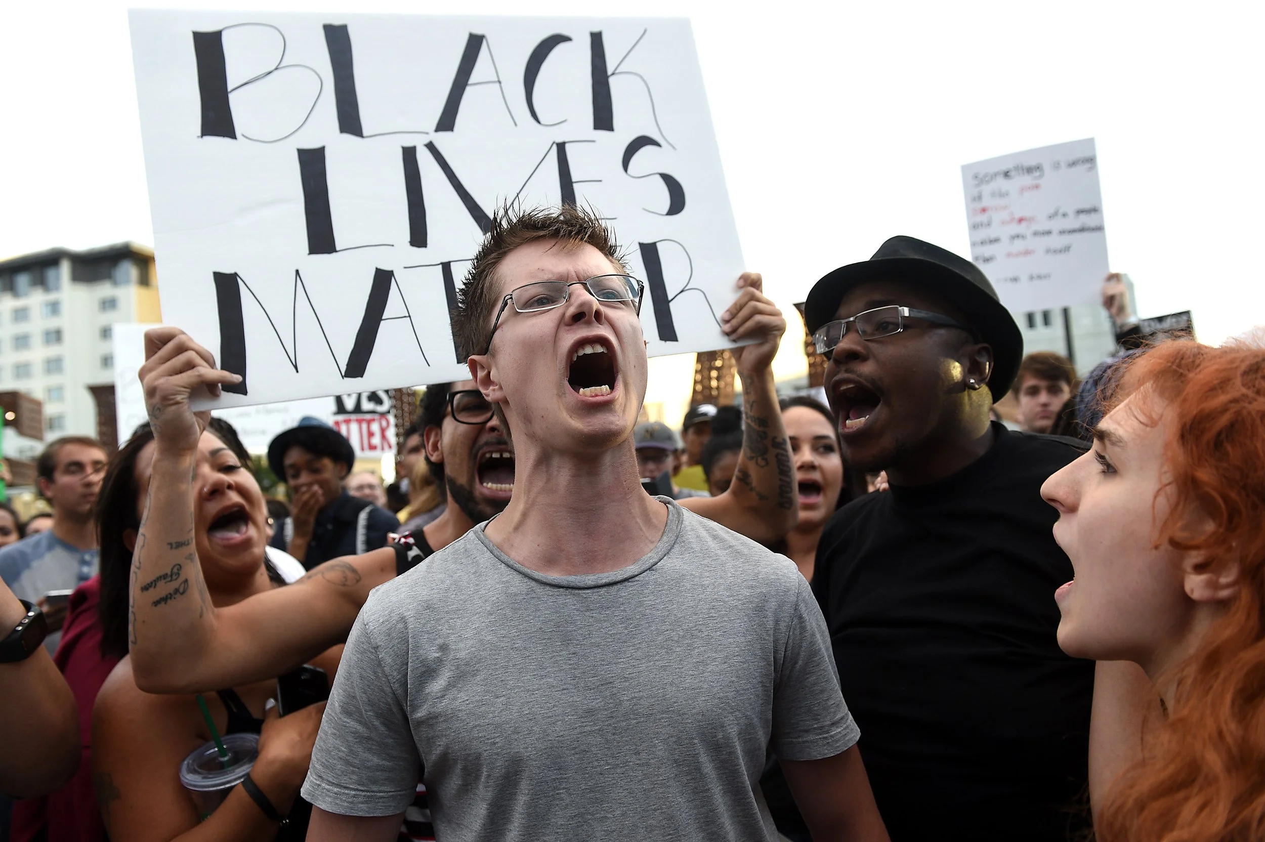 Anthony Brewer, middle, from Gardnerville, gets yelled at by protesters as he screamed "Donald Trump" over and over during a Black Lives Matter protest in Reno on July 15, 2016.
