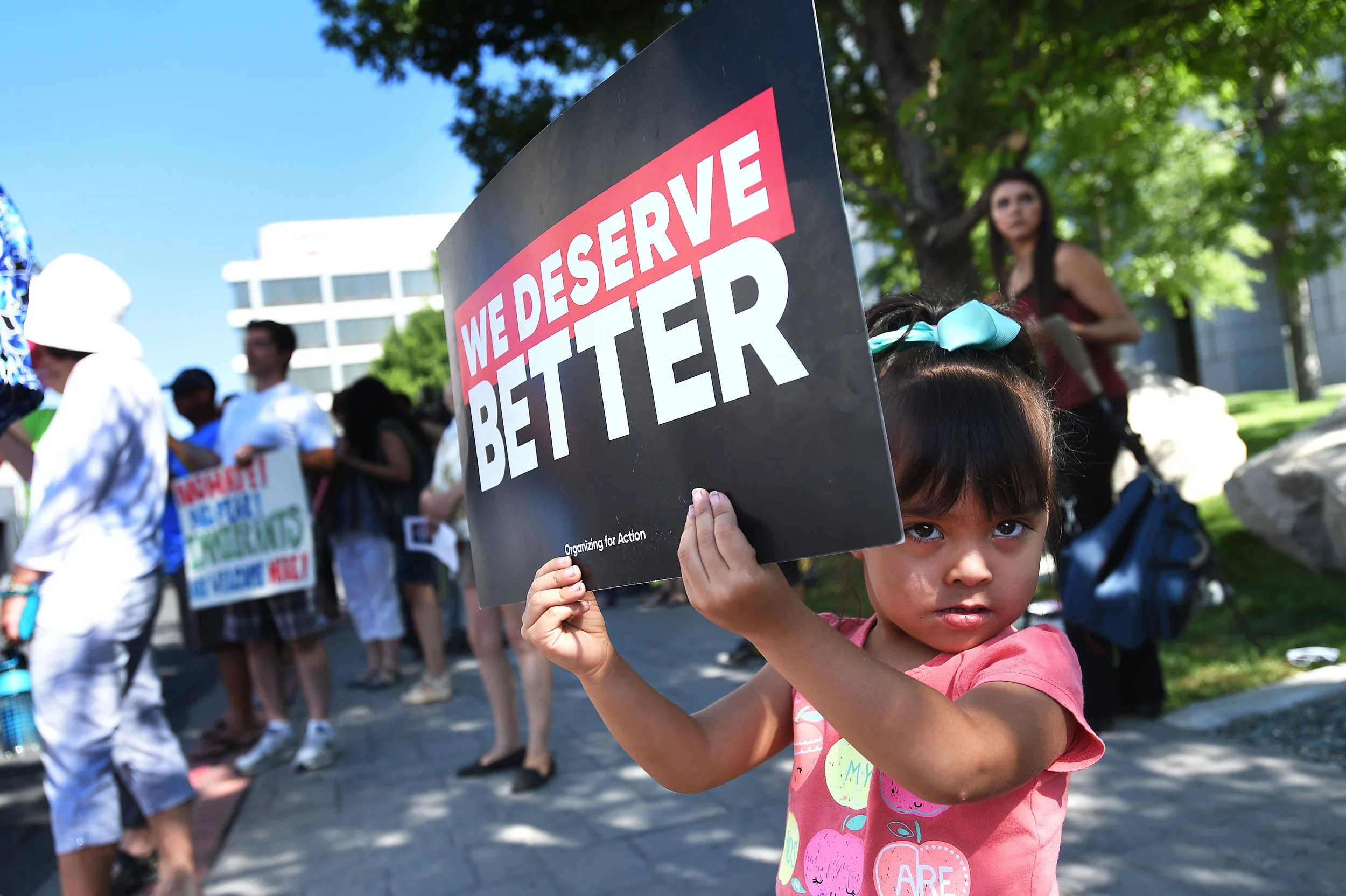3-year-old Yamileth Garcia holds up as sign in front of the Bruce R. Thompson Courthouse and Federal Building in Reno while protesting the ending of the DACA program on Sept. 5, 2017.