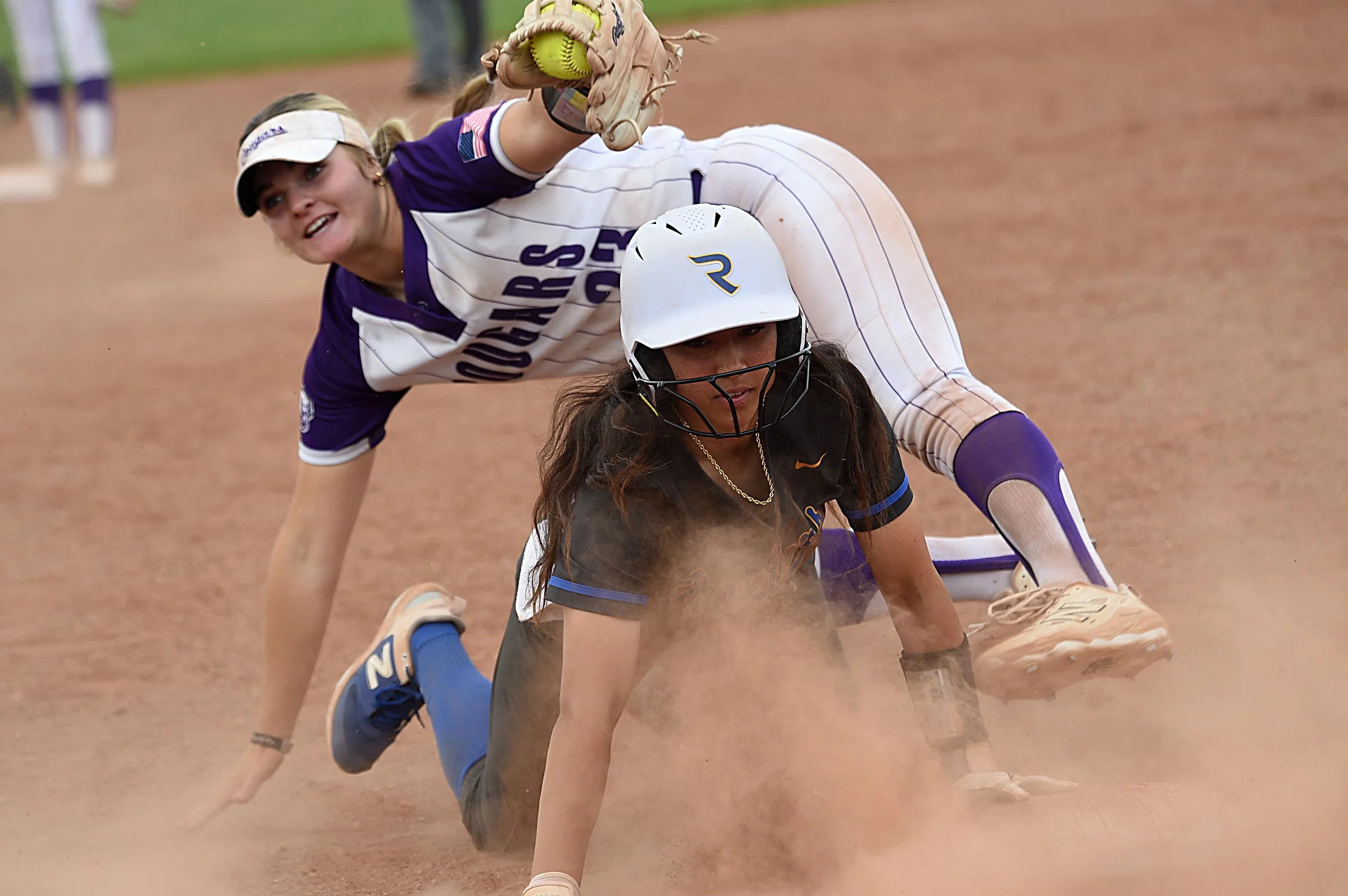 Reed’s Kehaulani Tambaoan slides safely into third under the tag of Spanish Springs’ Maddy Marshall during a double header on May 3, 2025. 