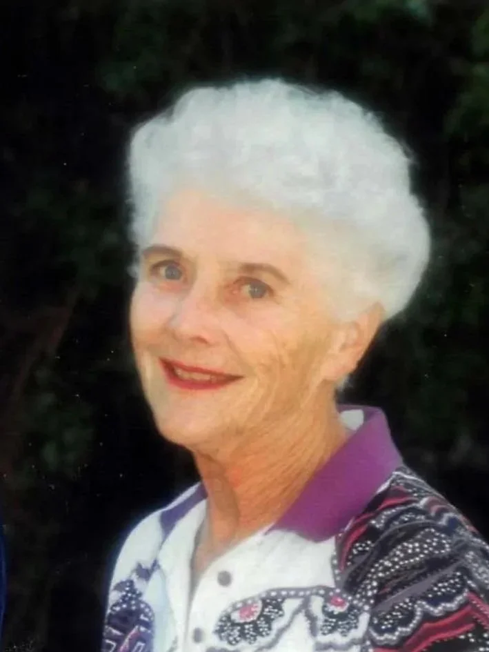 Lucille Rader, founder of the Lucille Rader Education Foundation, wearing a patterned tennis shirt with purple accents